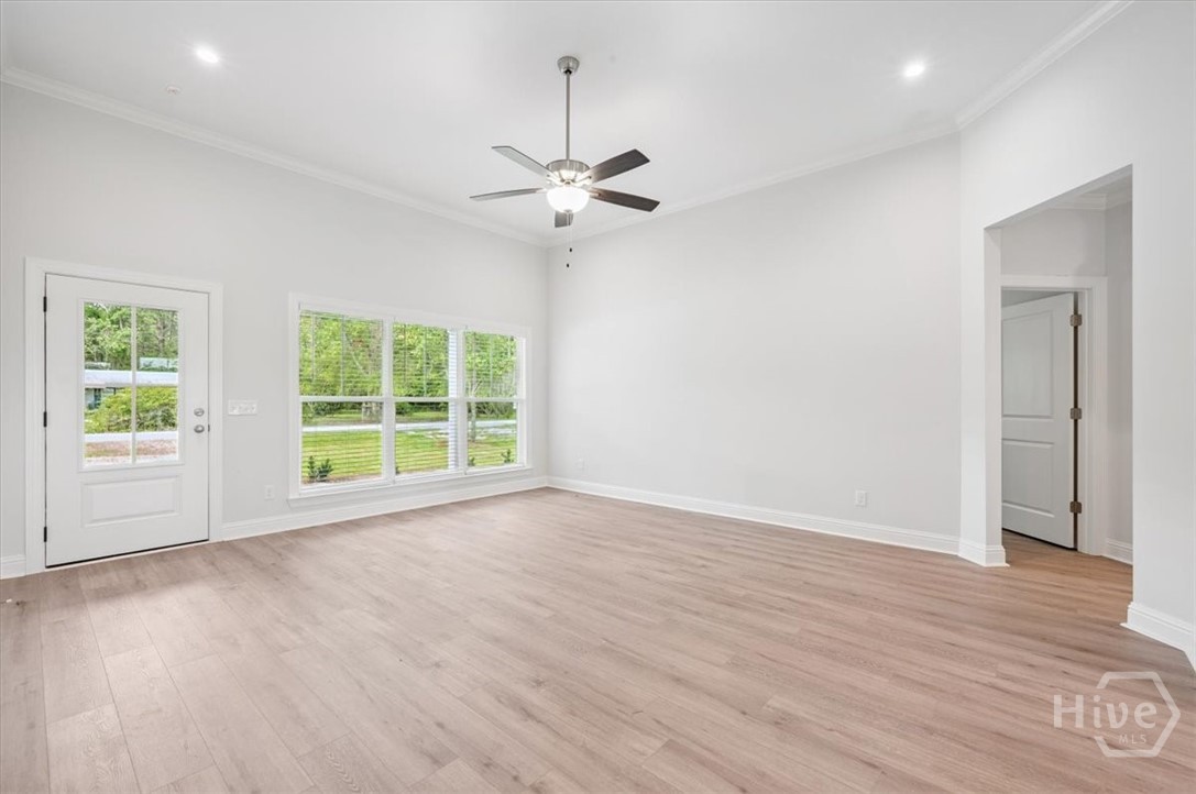 Large living room with refreshing ceiling fan.