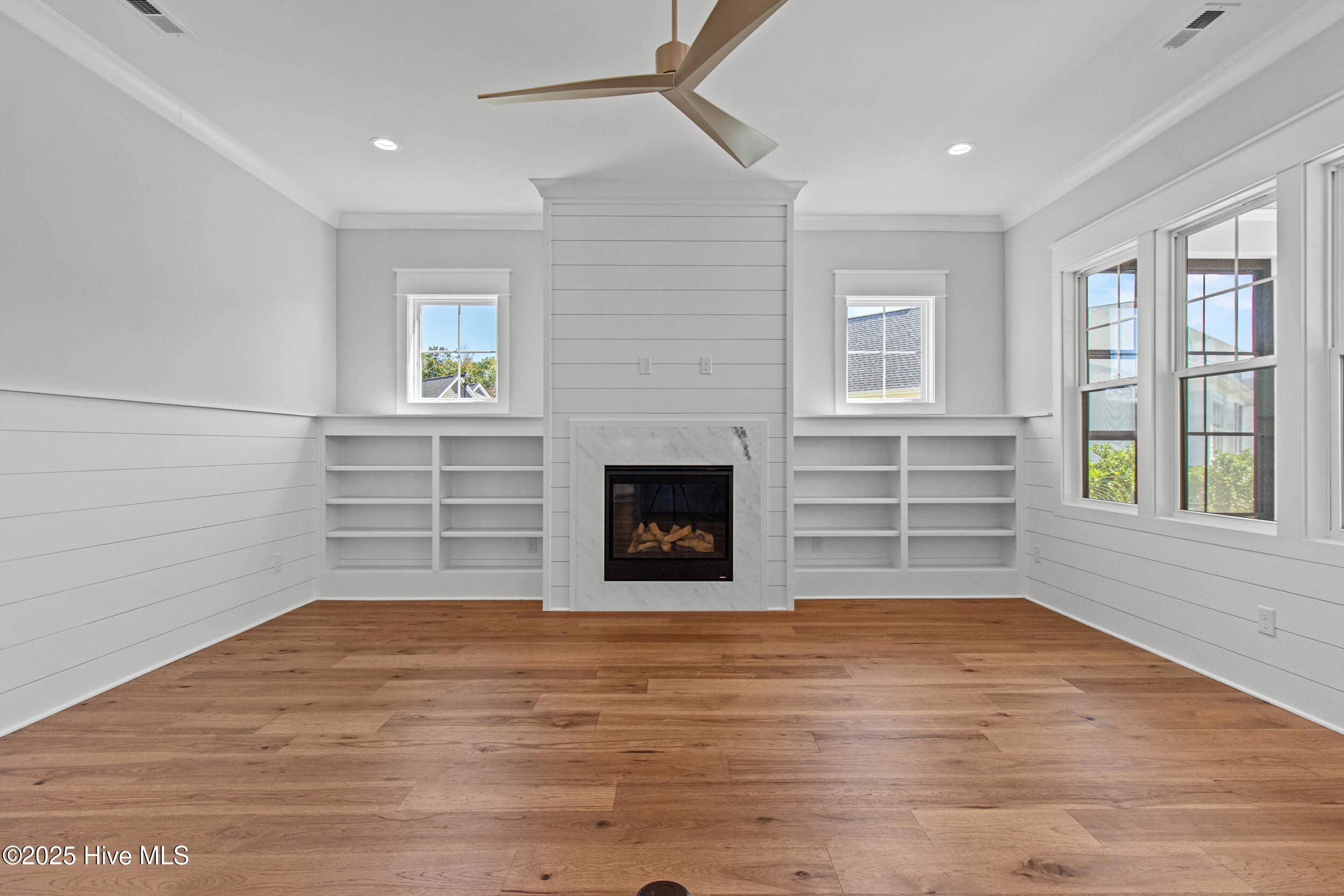 Living room with natural gas fire place and built-ins