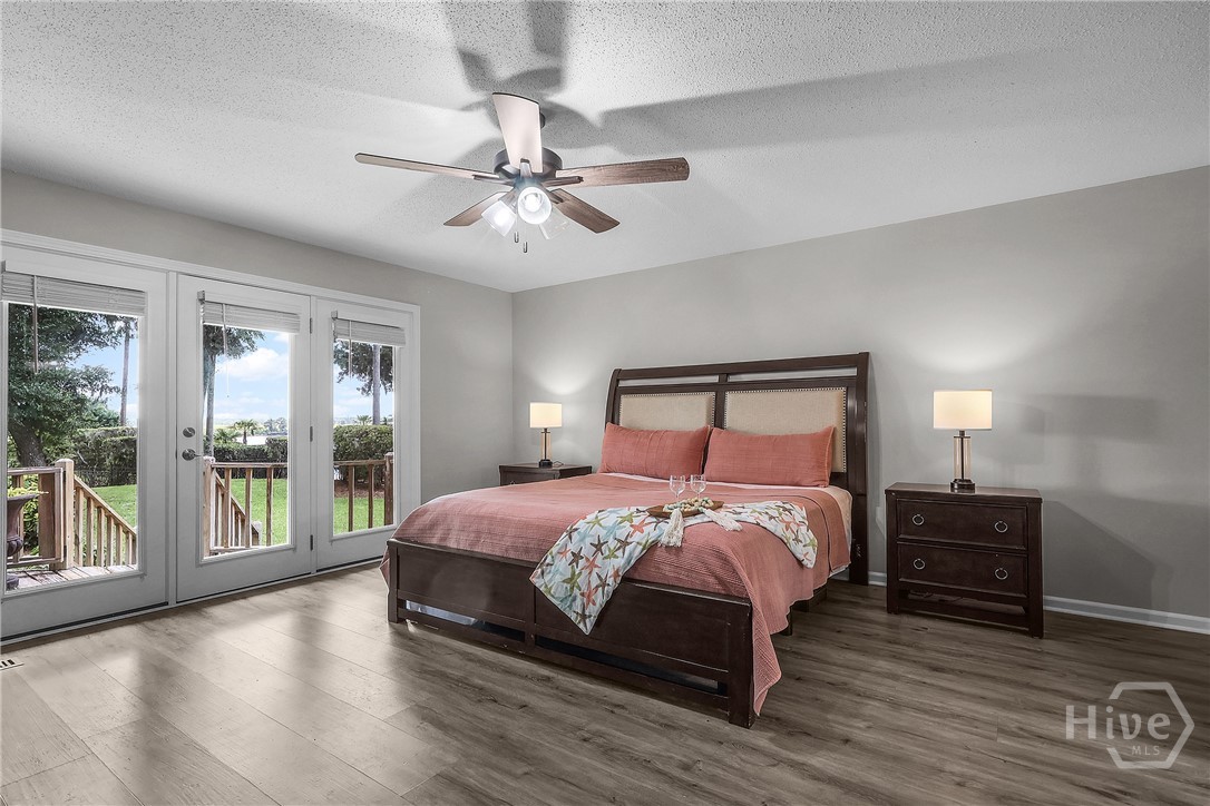 Primary bedroom with a river view