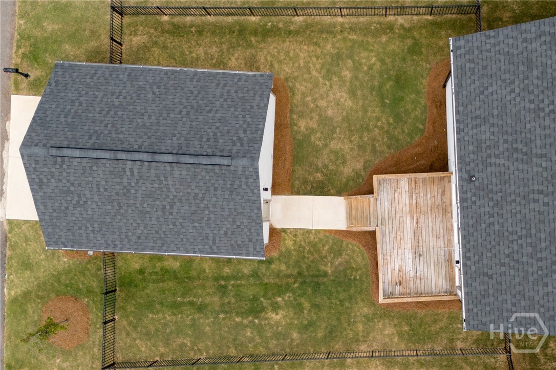 Backyard: Skip the hassle and expense of new construction with this level, move-in-ready yard already enclosed by premium black aluminum fencing.