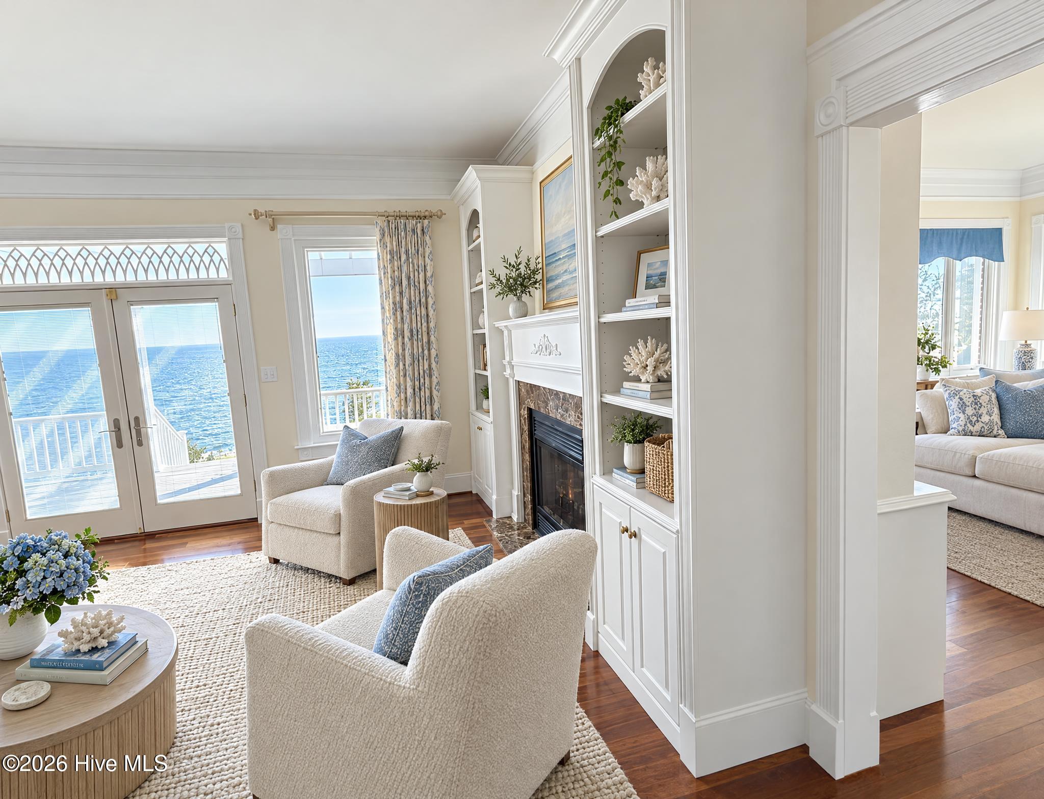 There is a fireplace connecting the kitchen/living room combo and this large living room that also has great waterfront views.