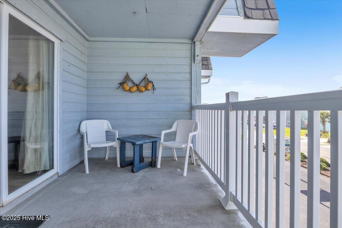 2714 W Beach Drive # 106, Oak Island, NC 28465 – photo 23: Balcony with a view