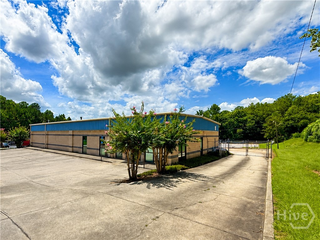 Side concrete drive and gated access, 255 Collins