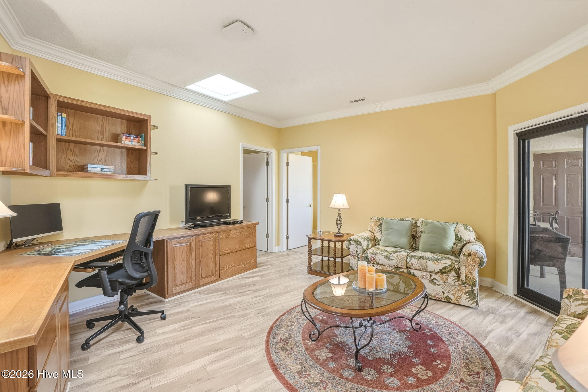 East Wing Den/Office or Media Room with private entrance to the balcony looking toward the west wing principal suite