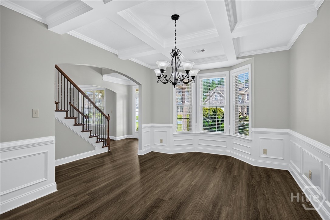 Formal DR with coffered ceiling and bow window