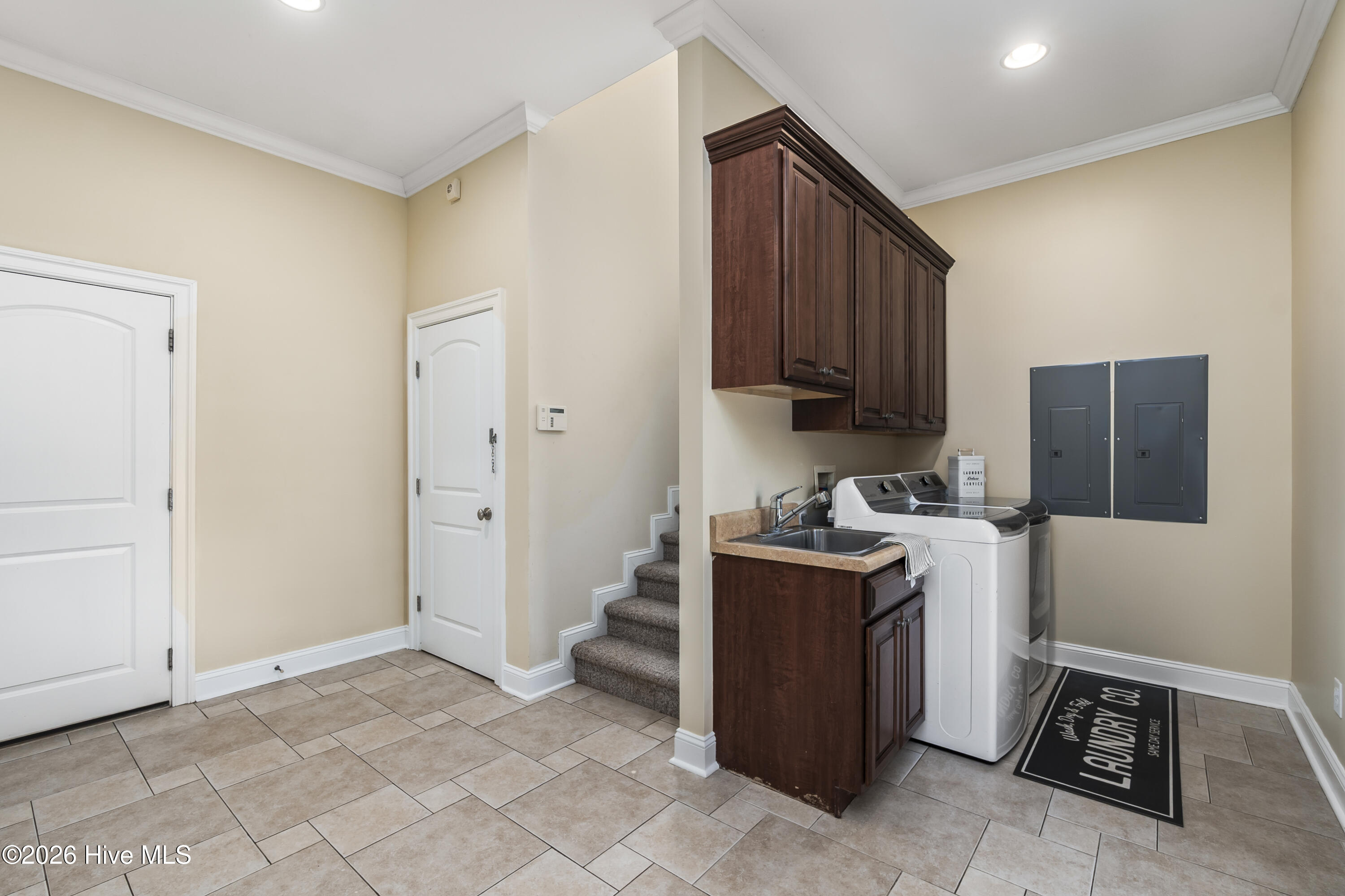 laundry, door to garage, utility closet, wash sink