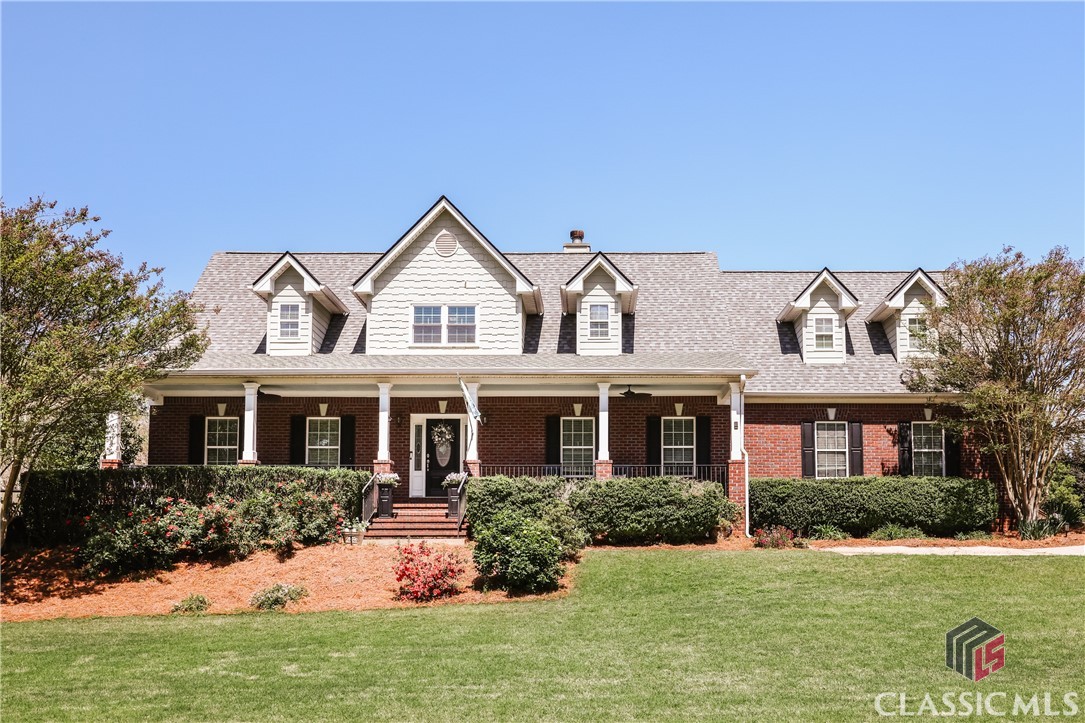 Welcome to 1011 Oaklake Trail in Watkinsville — a large brick home offering over 5,000 square feet of living space, including a fully finished walk-out basement. Located in the sought-after Oconee County School District, this home is just under 3 miles to Epps Bridge shopping and the Loop, and 1.5 miles to Malcom Bridge Elementary and Middle Schools and a short drive to North Oconee High School.This home features a primary suite on the main level with porch access, a walk-in closet, jetted tub, tiled shower and dual sinks.  The main level has 9-foot ceilings, a foyer, a vaulted living room with built-ins and a fireplace.  Off of the living room is a formal dining room, a half bath, an eat-in kitchen with porch access and granite countertops, top-tier stainless steel appliances and a breakfast bar. Completing the main level is a laundry room and a mud room entry off the main garage. Upstairs, a large secondary suite includes a full bath and walk-in closet. Down the hall from the secondary suite, along a hallway that overlooks the living room below, is an office/flex space.  The upstairs level also features a third bedroom with a seating area outside of it and a third full bath.  A large bonus room with a private staircase rounds out this level. The main floors have carpeted bedrooms, hardwood flooring in the living areas and tiled floors in the full baths, mudroom and laundry.The walkout finished basement offers a fourth bedroom, fourth full bath, gaming room/living area with fireplace, pool table, dart cabinet, wet bar with beverage refrigerator, exercise/flex space, and additional storage. There’s also a second garage with a dedicated workshop space, accessed by its own driveway on this level of the home.Additional highlights include two remote-start propane fireplaces (main floor and basement), hardwired Ethernet, and multiple flex spaces not listed individually. The oversized, fully fenced backyard features two custom stone patios, a propane grill, and a spacious covered back porch with a mounted TV. A welcoming rocking chair front porch completes the outdoor living options.Other upgrades include a roof under 5 years old, newer water heater, recently installed porch fans, a new garage door opener, plus a 4-zone expandable sprinkler system and ample closets and storage throughout.