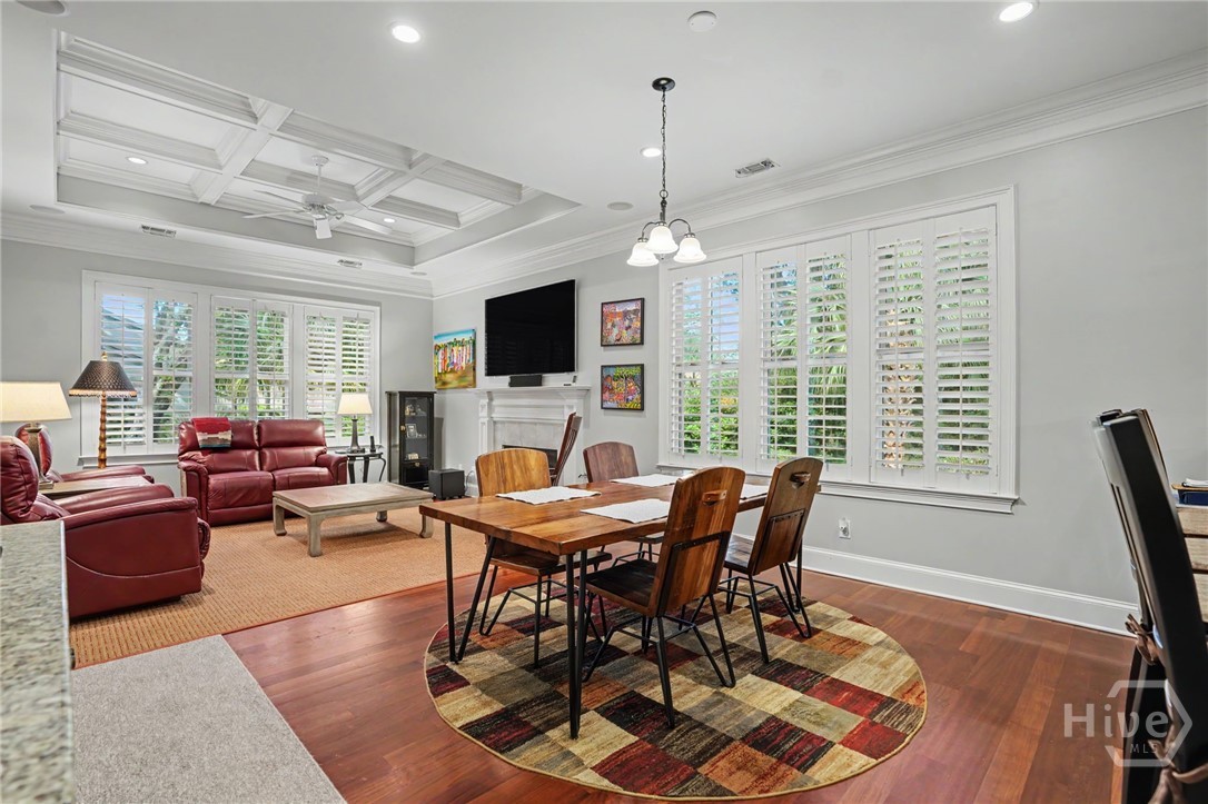 Kitchen is open to a Breakfast Area and den with coffered ceiling.  Breakfast Bar on the left side