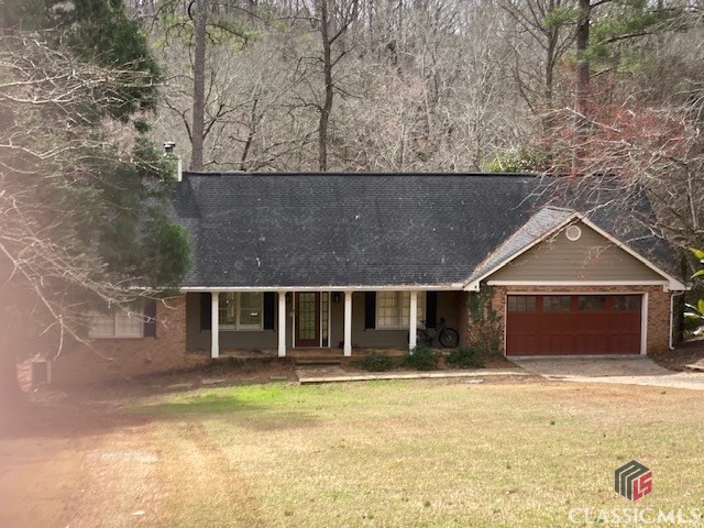 beautiful landscaping that provides a peaceful retreat, with the Middle Oconee river as a picturesque backdrop. Enjoy the sounds of nature on one of two back decks, one of which is partially covered, or relax in the gazebo by the river. The home's charm is further enhanced by the new driveway pavers and the flagstone covered front porch that warmly welcomes you.Inside, the main level features a master bedroom, and throughout the house, there are beautiful hardwood floors. The home has been upgraded with new high-end exterior doors, including an insulated garage door, and new stainless steel kitchen appliances, a farm sink, and smooth surface counter tops. Plantation shutters provide an additional touch of elegance. There are so many extras that you will not want to miss seeing this one.Located in the desirable Five Points area, this home is convenient to UGA, shopping, and theatres. This gem won't last long, so come see it before it's gone!