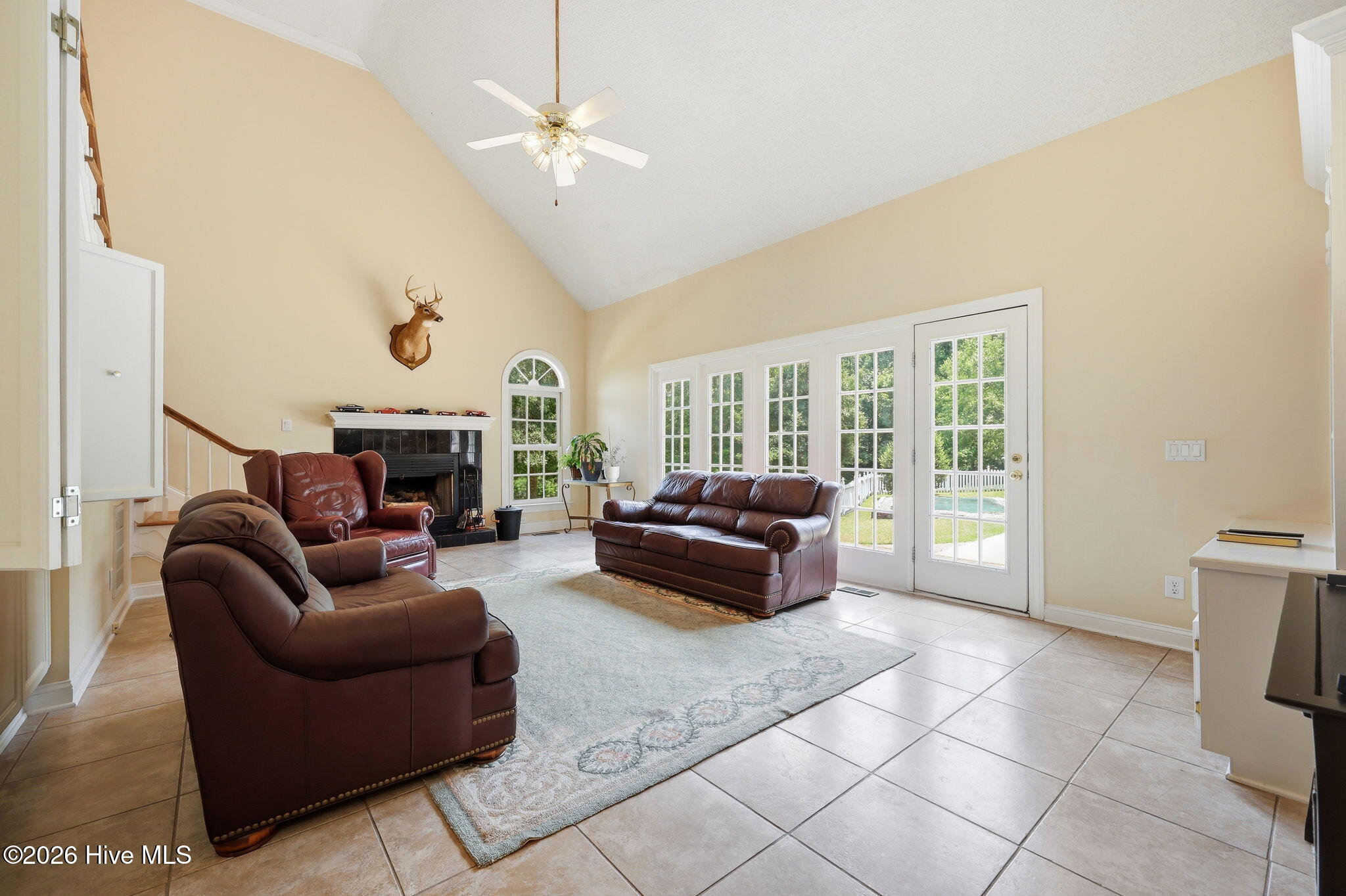 two story vaulted living is of great scale, with plenty of nautural lighting and a wet bar that closes off for discretion