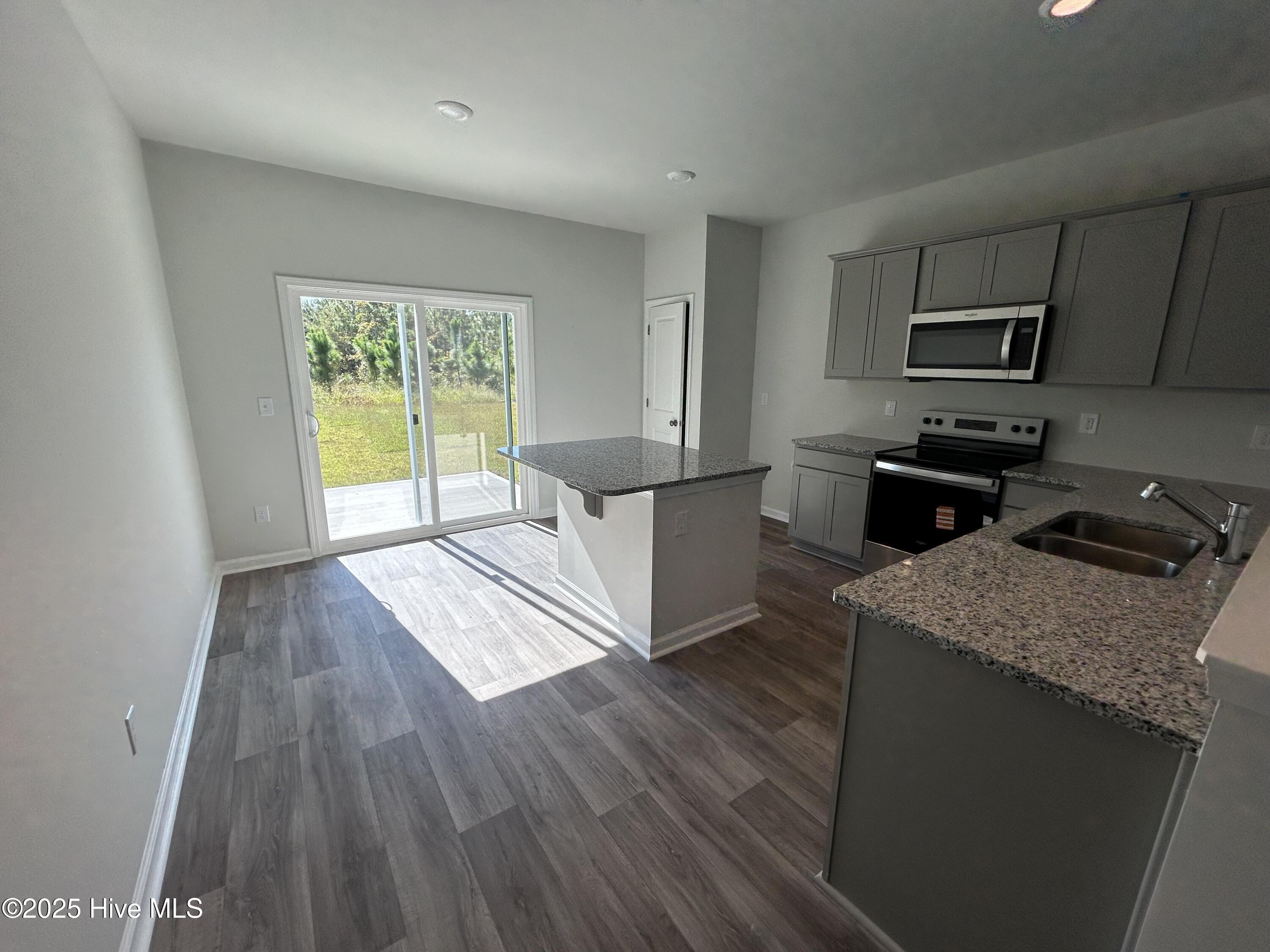 568 Coronado Avenue SE 16, Leland, NC 28451 – photo 8: Granite Countertops & Gray Cabinets