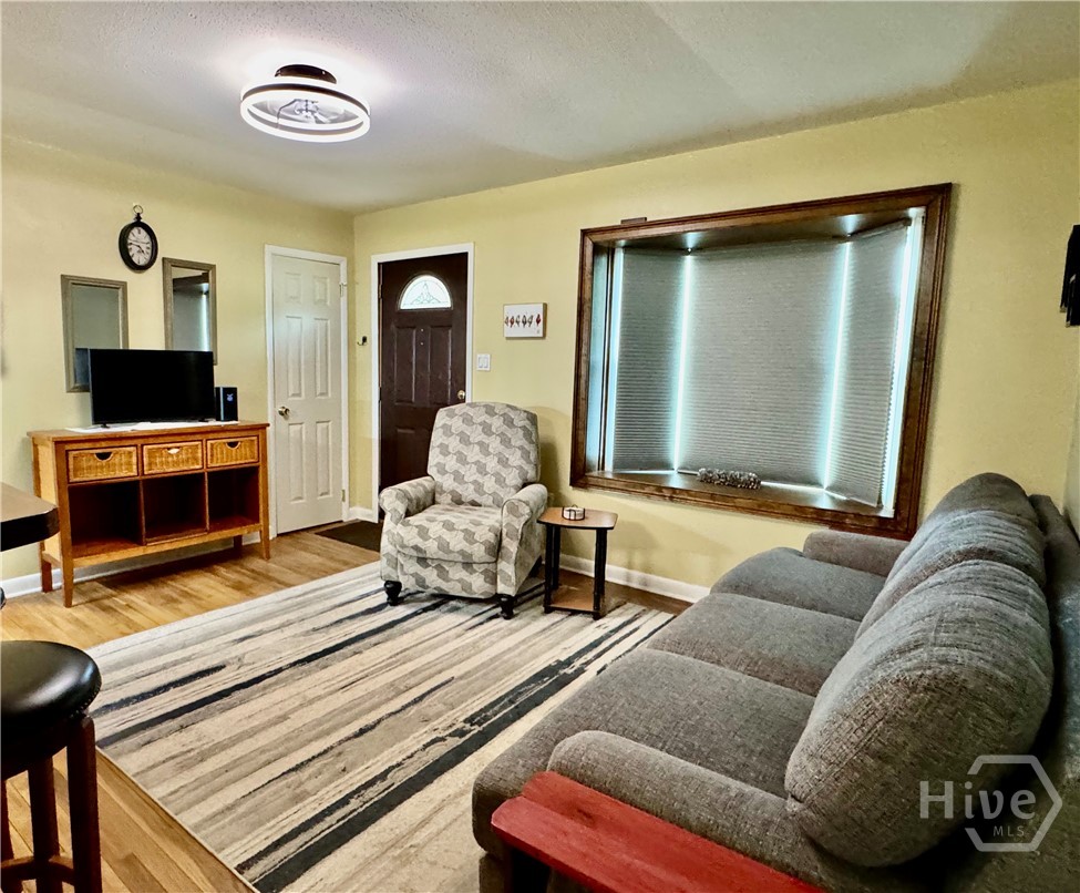 Living room blinds closed in bay window