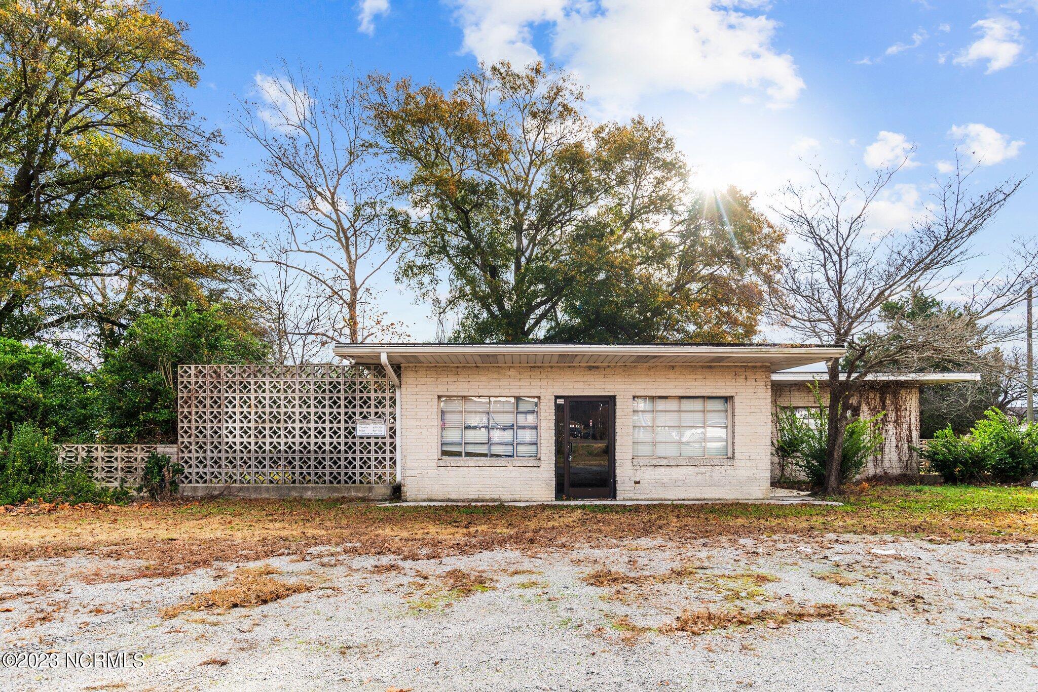 WOW!  HIGHLY VISIBLE CORNER COMMERCIAL LOT!  Great opportunity to start a business in this high traffic area. The possibilities are endless.  Nearby businesses include Belk, Wendy's, McDonalds, Speedway, Tractor Supply and Roses to name a few.  The building was once a Veterinary Clinic.  SOLD AS IS!