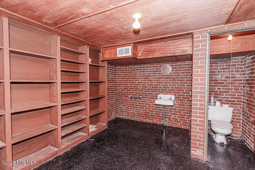Safe room with half bath in basement