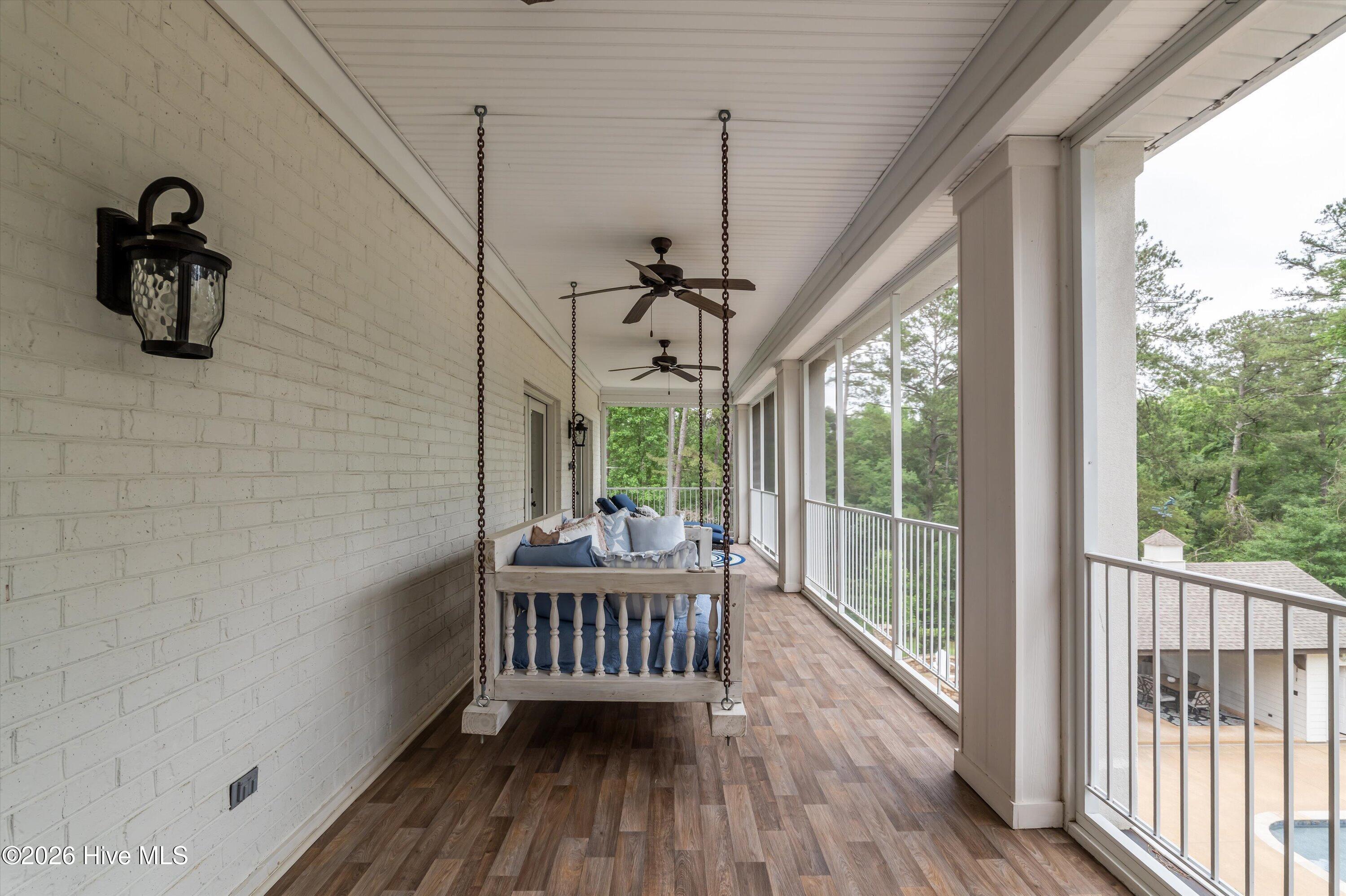 Upstairs screen porch accessed from master bedroom and guest bedroom #2.