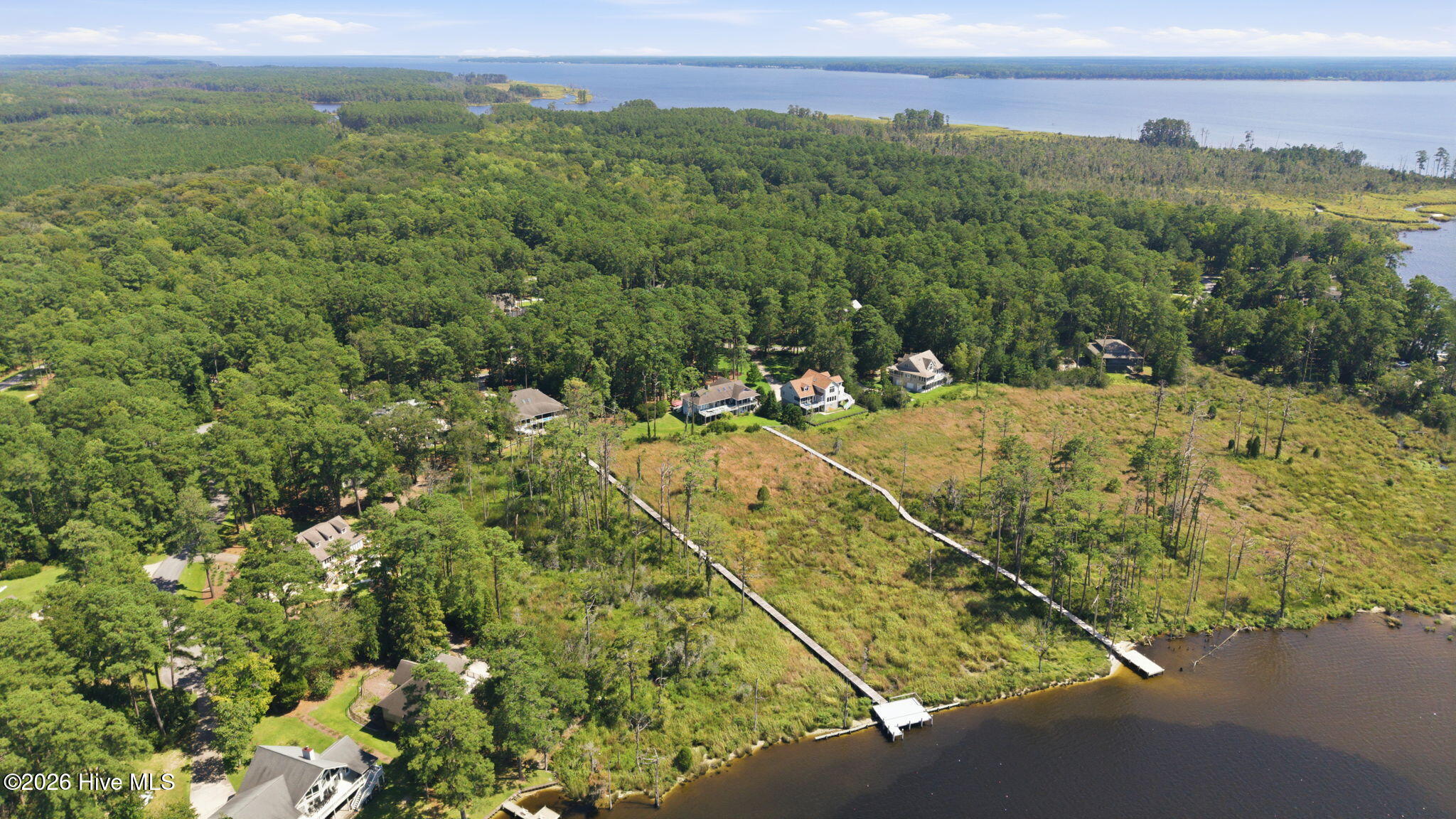 AERIAL SHOWING LOT LOCATED ON LEFT BETWEEN DOCKS