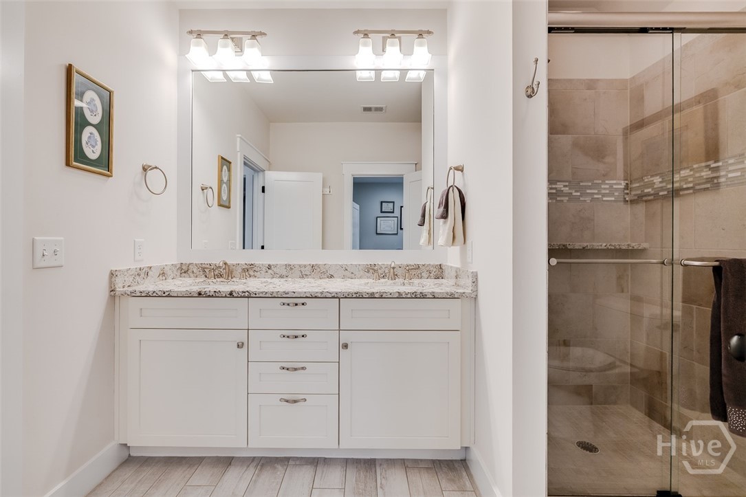 Jack and Jill bathroom with tiled shower