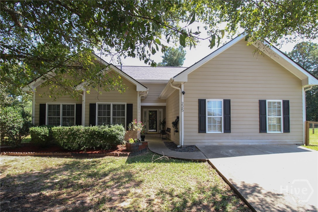 Excellent location meets pristine, move-in ready condition at 225 Camelot Drive. With a newly installed roof, modern HVAC and you will live in your new home worry free for years to come. This property boasts a large backyard with stylish new farmhouse style fencing perfect for pet lovers, a large outbuilding to house your boat, camper, or car, and a tranquil view of majestic cedar and pine trees to keep you birdwatchers busy year round!  The newly built patio features an all-natural wood pergola strung with Edison lights and equipped with new grilling equipment to complete the getaway mountain cabin feel in the backyard. The newly remodeled farmhouse kitchen with charming tin backsplash boasts brand new appliances, while new flooring, a state of the art security system, and even an electric car charger complete the country-meets-modern turnkey appeal. An added bonus: owners are downsizing and are offering a complete suite of landscaping equipment (including new self-propelled mower, leaf blower, and trimmer) along with any interior furnishing desired by the buyer to be included with the sale. Located a short bike ride from downtown Athens and convenient to great shopping and dining, this home is a unique find in this sought after Athens neighborhood.