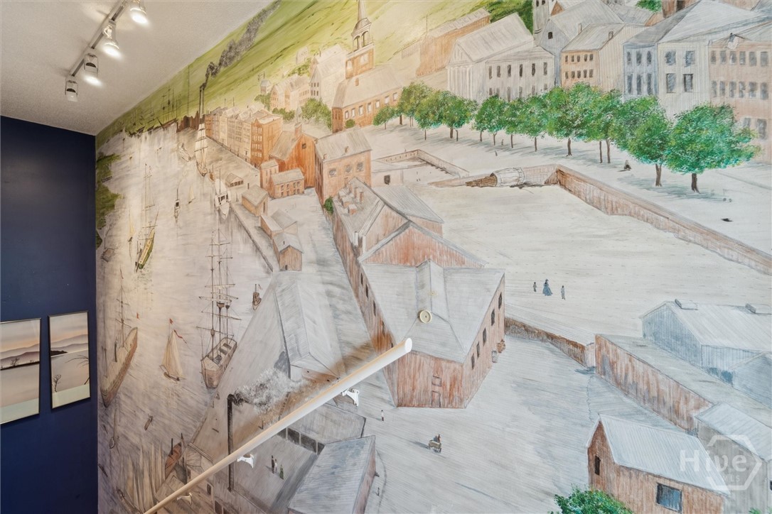 Savannah's historic waterfront is displayed in the stairway.