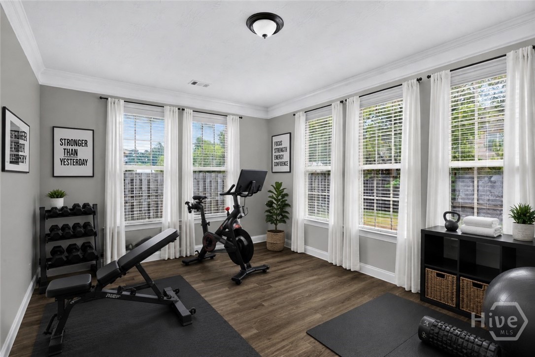 Flex room off kitchen virtually staged as home gym