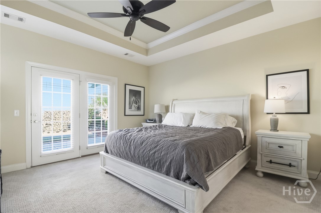 Primary Bedroom with French Doors leading to patio.