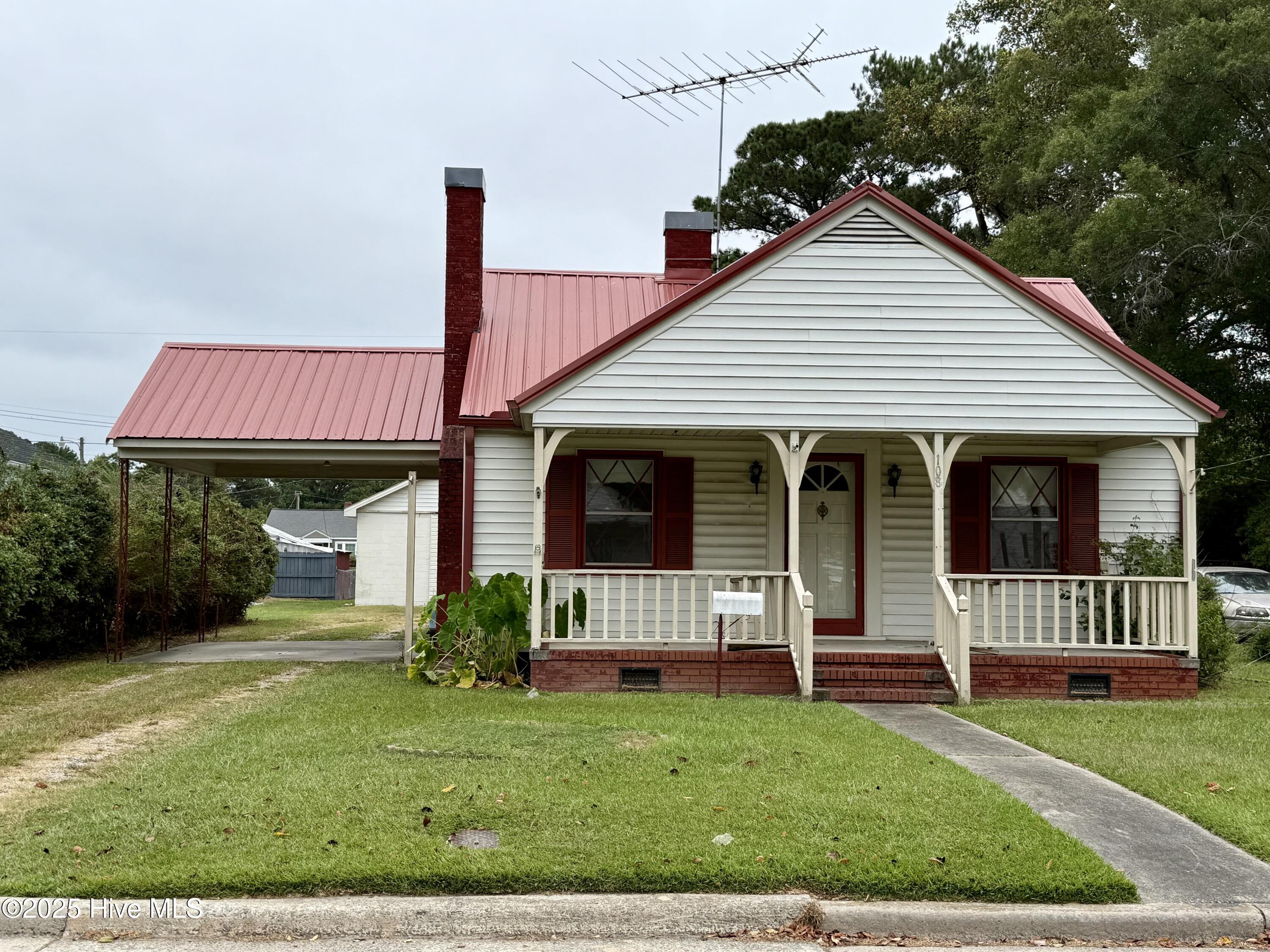 Discover your new home in the heart of Williamston's desirable West End community. This charming 3-bedroom, 1-bathroom residence offers a perfect blend of classic character and modern convenience, creating an ideal setting for making memories.Step inside and be greeted by a spacious kitchen and dining area, thoughtfully designed to accommodate gatherings of all sizes with friends and family. The main level features a welcoming bedroom that showcases beautiful hardwood floors, original solid wood doors, and vintage doorknobs—details that add a touch of timeless quality. A large, dedicated laundry room provides ample space and includes washer/dryer hookups for your convenience.Upstairs, you will find two additional cozy bedrooms and a practical walk-in attic, offering excellent storage solutions. The home is equipped with a reliable Trane central gas pack and is connected to city water and sewer, ensuring comfort and peace of mind.Key Features:- 3 Bedrooms, 1 Full Bathroom- Expansive kitchen and dining area perfect for entertaining-Downstairs bedroom with original hardwood floors and classic details-Two upstairs bedrooms with a walk-in attic-Attached single-carport for protected parkingOne of the standout features of this property is the massive 40' x 40' detached outbuilding. Complete with a loft for extra storage, this versatile space is perfect for a workshop, a man cave, or housing all your recreational gear.Situated in a prime Williamston location, this vinyl-sided home combines comfort, character, and utility. Opportunities like this are rare.Don't miss your chance to see this unique property. Contact us today to schedule your private viewing before it's gone