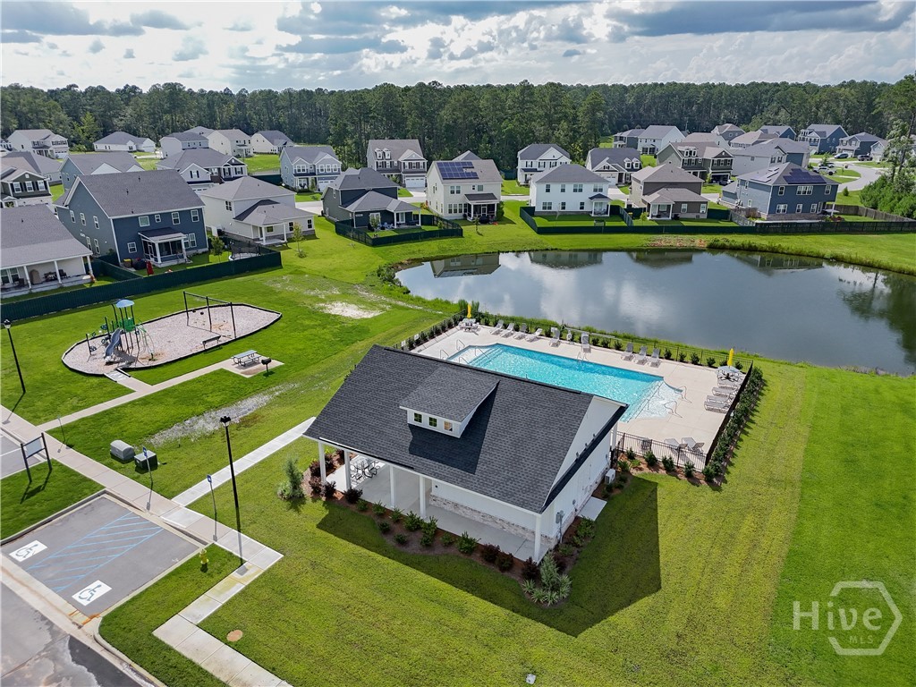 Community amenity center features a pool, cabana and playground.