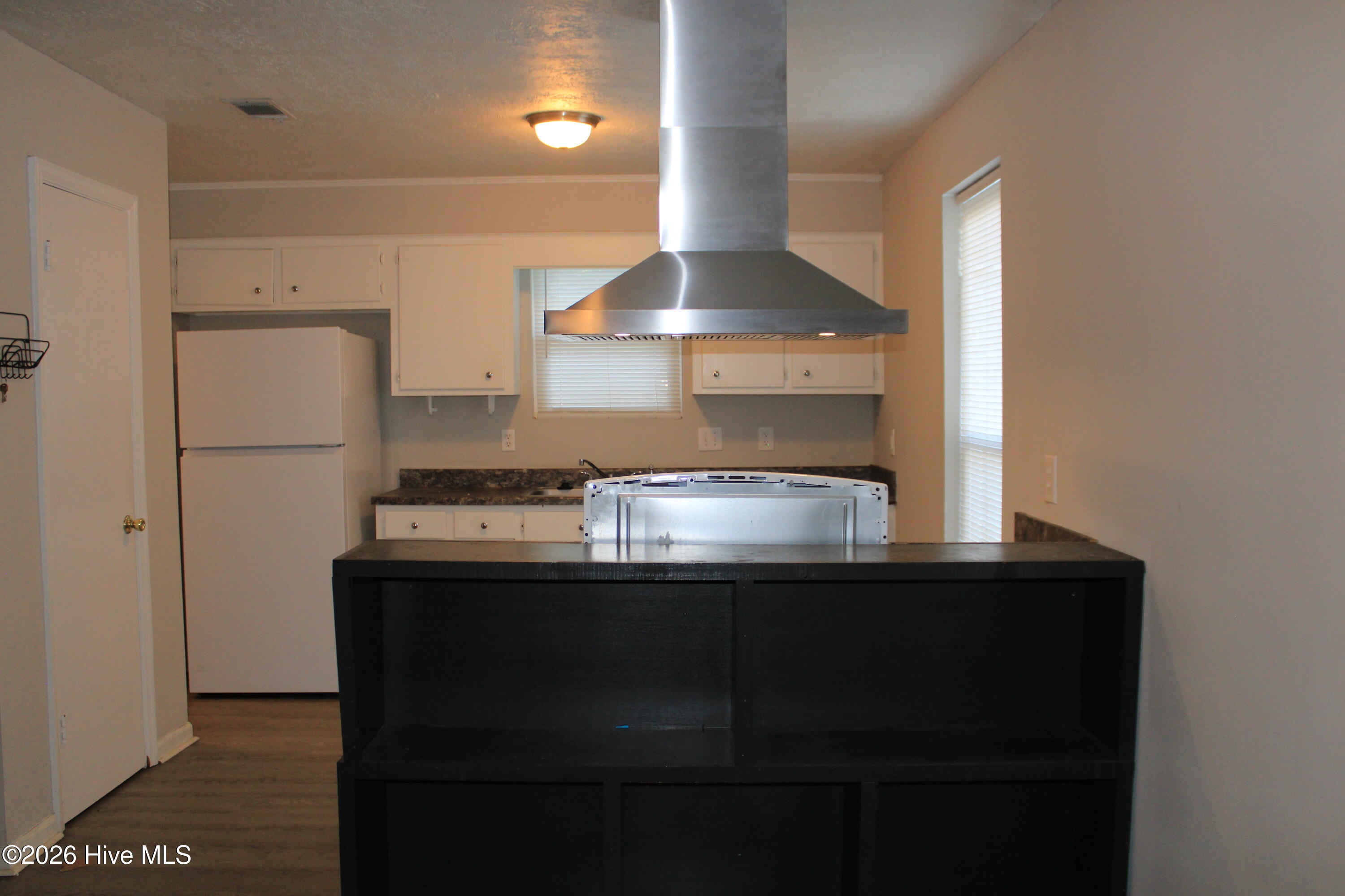 Island Range Vent Hood and pantry.