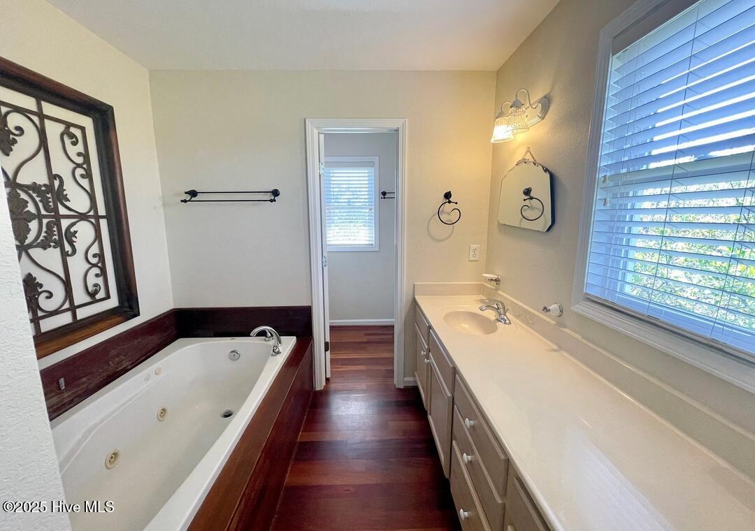 Upstairs primary bath with soaking tub and separate shower, dual sink and extra vanity