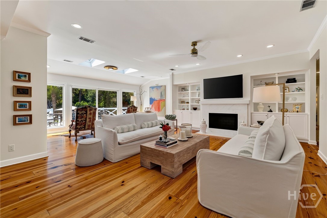 Family Room overlooking pool and lagoon with fireplace