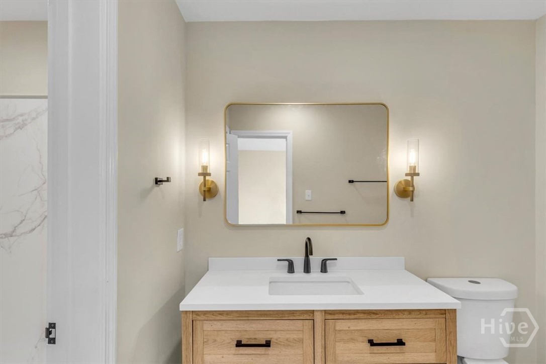 Back bedroom's sink and toilet
