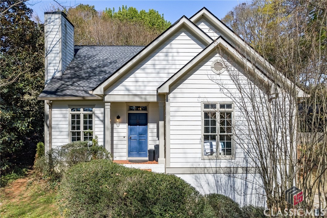 This exquisite home combines seclusion and convenience in a prime location. Situated on over 1/2 acre atop a hill, it provides ample privacy. The residence has been recently updated with an upstairs addition by Structure and features updated rooms throughout, a new roof, and two new HVAC units.The main floor includes a cozy living room, a den with stunning backyard views, an open galley kitchen with a sizable island, and a luxurious master suite with double vanities and a full-tile shower. Upstairs are three spacious bedrooms, two full bathrooms, and a laundry room. The finished basement provides ample daylight and a versatile bonus room. The terraced backyard features a private patio and storage shed, perfect for gardening or children's toys.This home offers exceptional living spaces, ample natural light, and great outdoor living opportunities while just minutes away from the University of Georgia and the dining and shopping of Five Points, Athens.