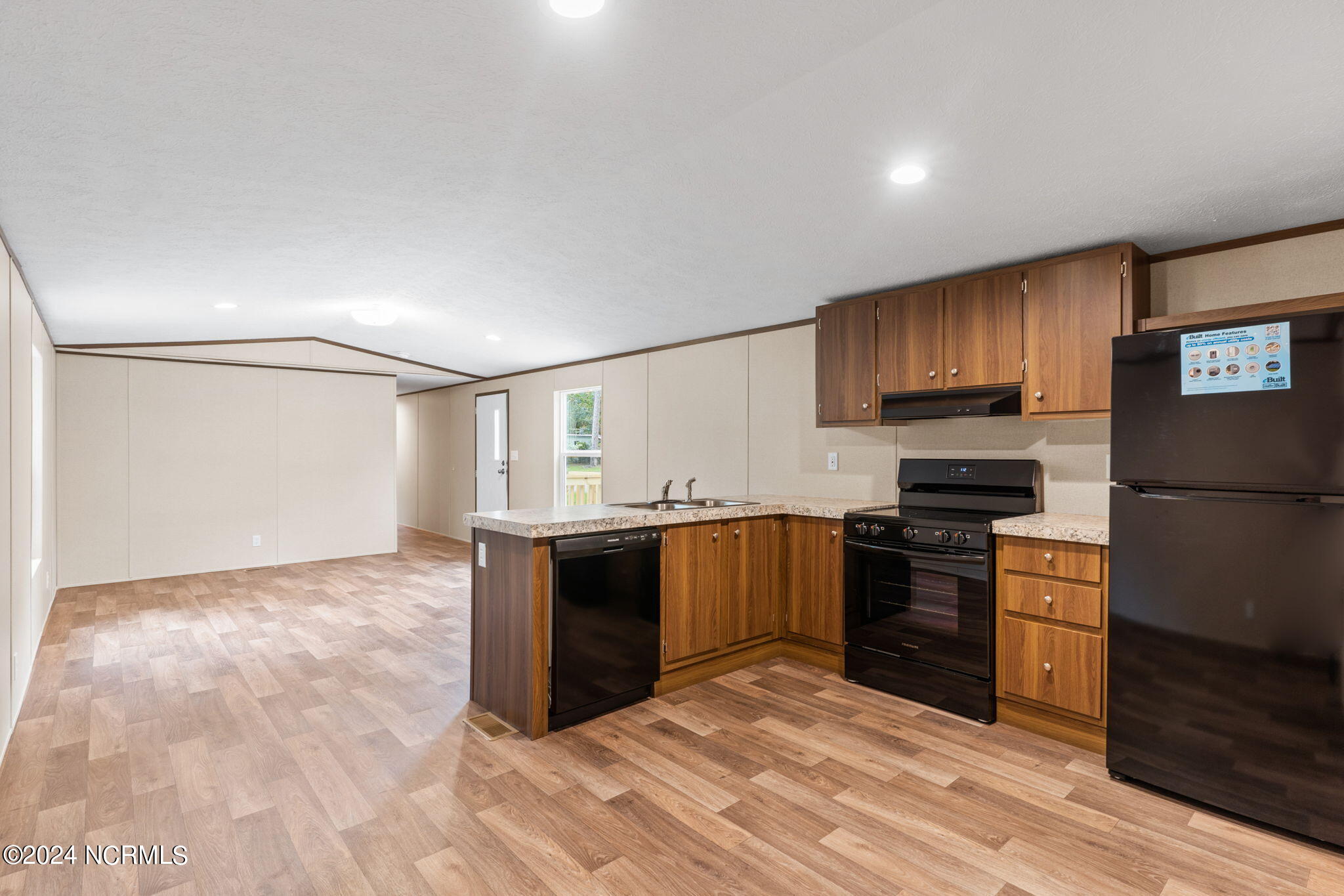 1404 Mockingbird Place SW, Shallotte, NC 28470 – photo 12: Kitchen/Living Room