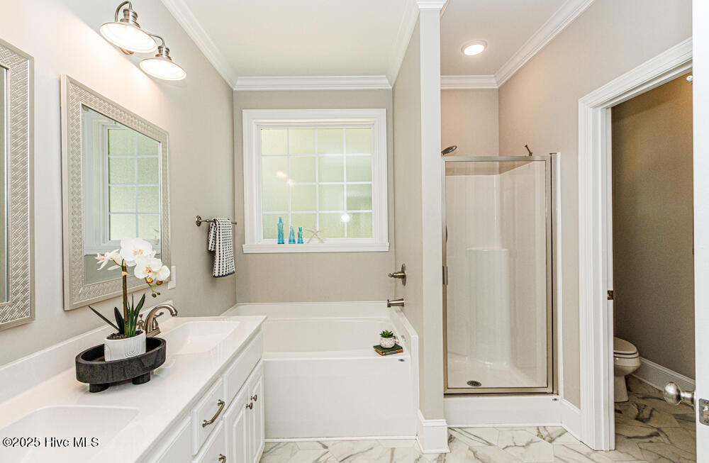 Primary bathroom has soaking tub as well as separate shower.