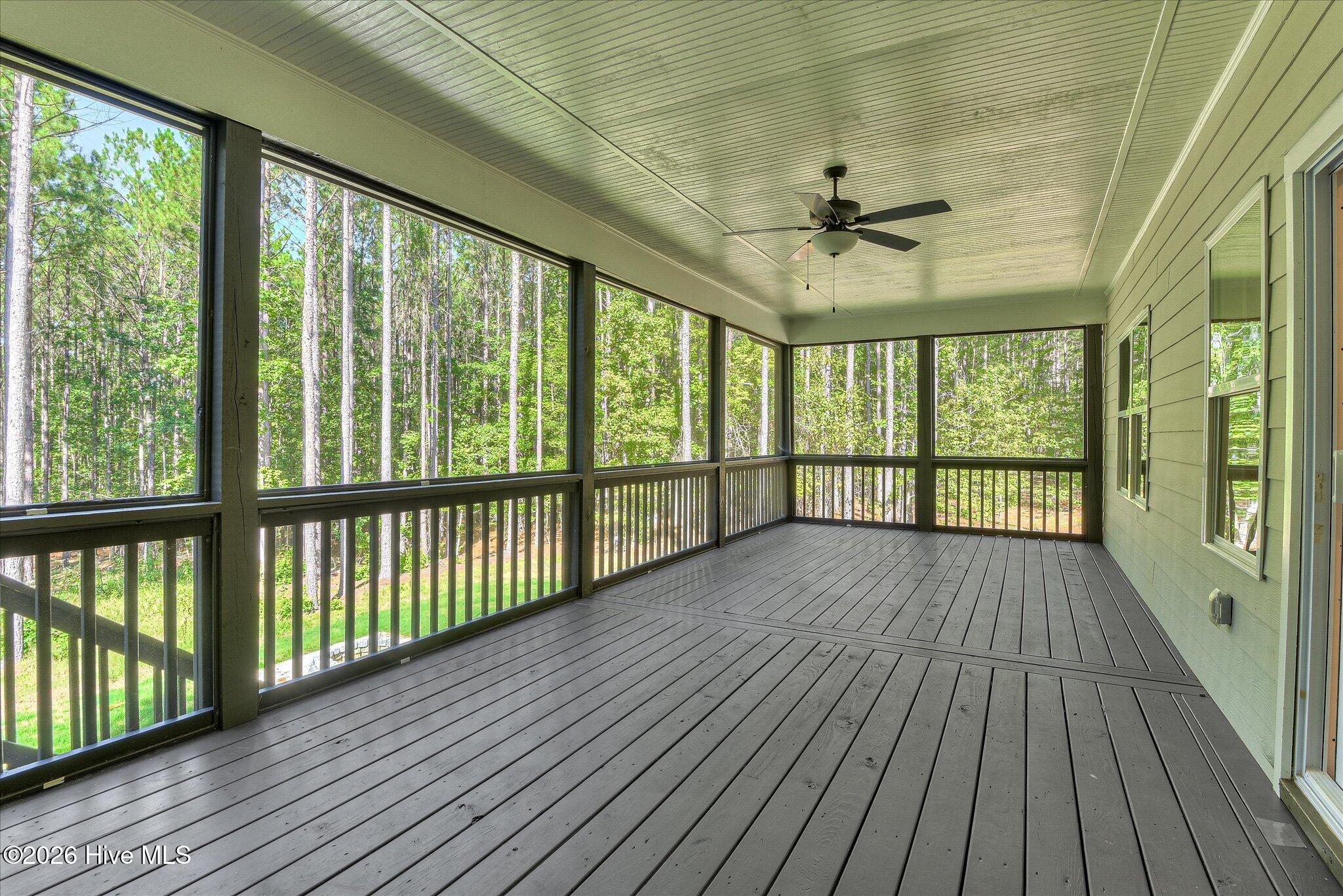 Screened porch stretches across the back of the home.