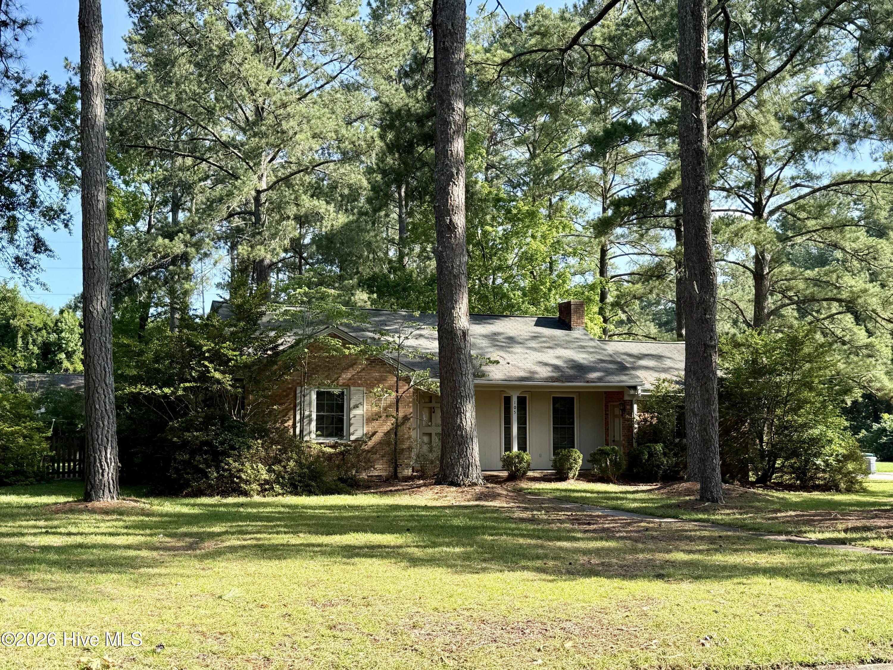 Welcome to the heart of Robersonville, NC, where small-town living meets comfort and convenience! Located just 25 minutes from Greenville, this adorable 2 bedroom, 1 full bathroom home offers classic charm with thoughtful updates throughout. Beautiful original wood floors flow through the bedrooms, living room, and dining area, adding warmth and character to the home. Updated windows, a central HVAC system, and a tankless propane water heater provide modern comfort and efficiency.The dining room is conveniently located just off the kitchen and features a large plant window that brings in natural light. The kitchen offers charming knotty pine wood cabinets along with a built-in microwave, electric range, and refrigerator. The bathroom features original tile, a full tub/shower combination, and an updated vanity. An added den or bonus room provides extra space for a home office, hobby room, or additional living area.The crawlspace has also been encapsulated and includes a dehumidifier and sump pump, adding another valuable upgrade to the home. Outside, you'll find a fenced backyard, perfect for outdoor enjoyment, along with a detached outbuilding for additional storage. Come see all this charming Robersonville home has to offer before it's too late!