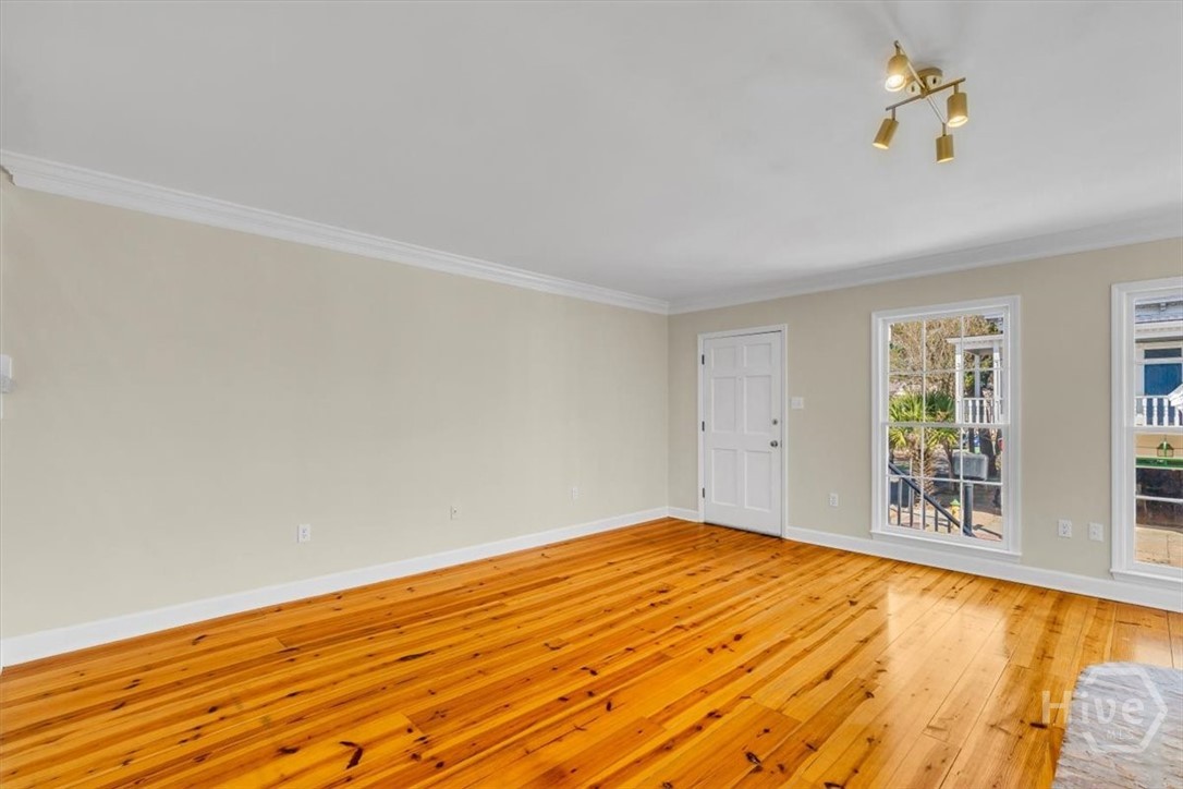 Entrance into living room with two large windows