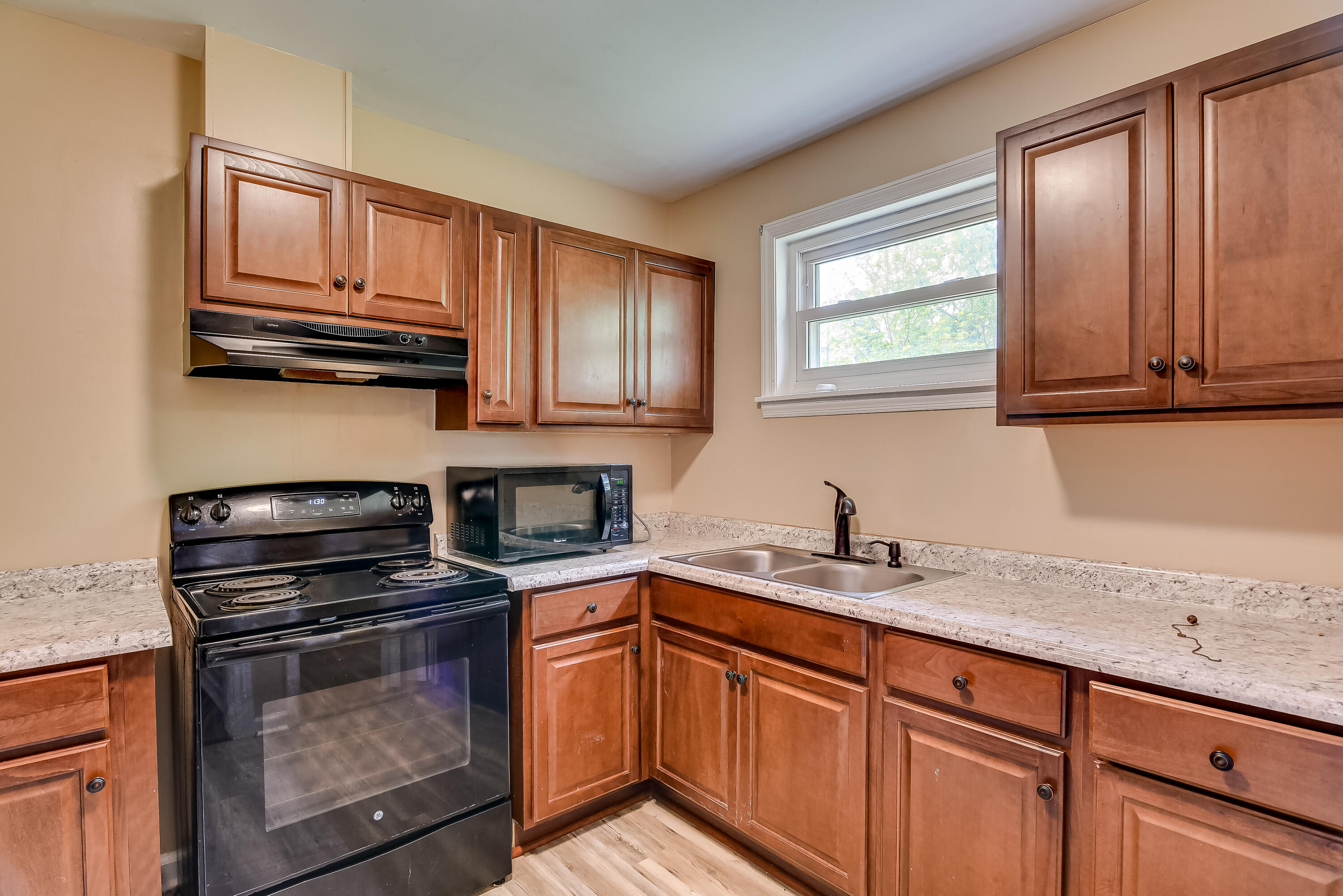 Kitchen view with range and micro