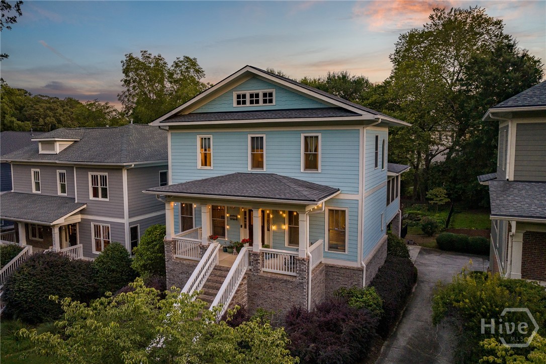 Most houses hum one tune. This one? A whole playlist of moods.

163 Easy Street sits a block from Boulevard in Parkside at Normaltown, a 15-home enclave where neighbors wave but don’t pry, and morning coffee tastes better because Sips is just around the corner. Built in 2004 by John Willis Homes, it’s solid in its bones but sly in its details, always just a little more thoughtful than expected.

On the main floor, it plays gracious host: formal dining ready for holiday roasts or poker nights, an office/library that reads business in the morning, but welcomes a science fair project, or an unfinished novel, by afternoon. The kitchen hums with purpose: a commercial ice machine that feels like an overindulgence until you can’t live without it; a butler’s pantry tucks gadgets away for later; windows framing green instead of neighbors. The living room keeps the spotlight balanced, built-ins and a Heatilator fireplace at center, tall picture windows throwing in the kind of natural light that makes everything sparkle. By the time you wander onto the screened porch or Trex deck, the house has already shifted to its softer mood: linger, stay, watch a sunset not the clock.

Upstairs, the primary suite prefers a little drama: vaulted ceilings, its own fireplace, treetop views that change wardrobe each season, and a mini-split for micro personalized comfort. Two more bedrooms keep things calmer, sharing a Jack-and-Jill with two separate vanities that stay politely out of the way.

The terrace level has a different mindset: more calculating, less dreamy. A fully finished apartment with its own entrance, kitchen, laundry, bedroom, and steam shower. It’s the side of the house that thinks in spreadsheets: rental income, multigenerational living, six-month stays that turn into twelve. A flex room (currently a gym) and lockable garage storage only add to the practicality. In Boulevard, where rentable space disappears in seconds, this is the rare side of a home that pays dividends.

Recent updates—roof (2020), HVAC, water heater, mini-split—make the practical voice even louder. Outside, a fenced backyard leans green and quiet, the kind of stage any Sandy, curled up in the final act, would happily call her own. Parkside’s shared greenspace adds just a little more breathing room.

Morning mood? Coffee at Sips. Afternoon? A beer at Hi-Lo. Evening? Rooftop dining in Normaltown. And just beyond the calm, Cobbham and downtown open up—music, patios, and the pulse of Athens at full tilt.
163 Easy Street doesn’t just speak. It plays different scenes, some lit in lamplight with books and bourbon, others wide open with morning windows and laughter; shifting, adapting to your needs.
And whichever side you meet first, it’ll feel like the right one.