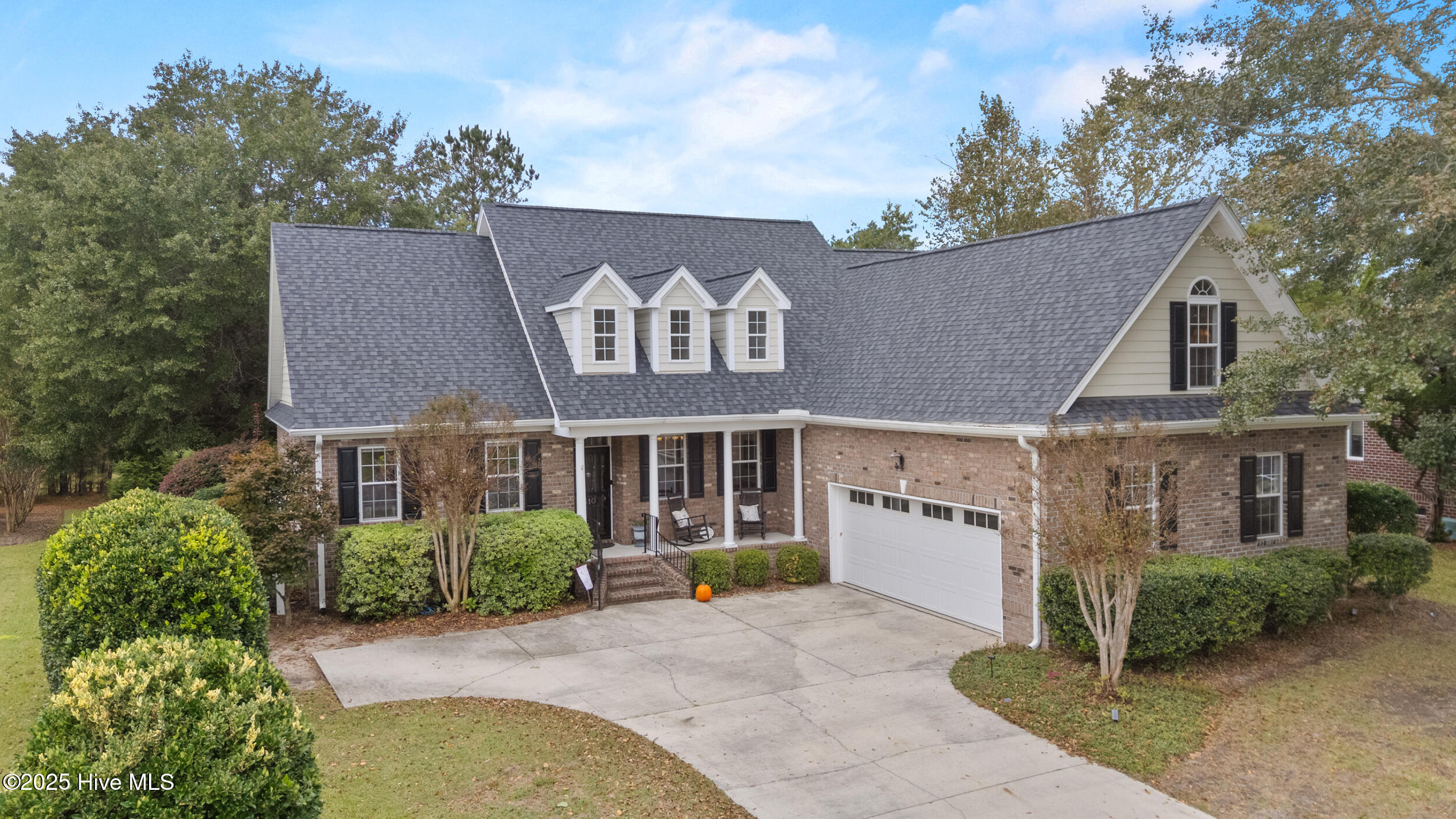 Offered at THE LOWEST COST PER SQUARE FOOT OF ANY HOME IN MAGNOLIA GREENS by over $20 a foot. Situated on almost 1/3 acre, this over 3300 sq ft ALL BRICK home has 4 bedrooms, 3 1/2 baths and a bonus room big enough for your home theater, family suite, or game room. SOLID HARDWOOD FLOORS cover most of the main floor and those FLOORS will be PROFESSIONALLY SANDED AND REFINISHED to perfection before your closing.  In addition the first-floor bedrooms will have NEW CARPET installed before closing. The chef in your household will appreciate the quartz counter space and center island. The Primary suite features a separate bathtub and custom tiled shower enclosure. Plenty of space for all your clothes in the 7' x 11' ft walk in closet. A SPLIT FLOOR PLAN provides everyone with privacy and comfort.  The sunroom is perfect for morning coffee or afternoon refreshments as it is shaded most of the time due to the canopy of trees. If storage is something you need, you have it in abundance here. The garage is extra wide (28 feet) and the 2nd floor has a 10' x 11' ft foot CLIMATE CONTROLLED STORAGE room. For your peace of mind, this home comes with a HOME WARRANTY.  Established trees and mature landscaping are what you find in Magnolia Greens and this fabulous home is surrounded by it. Magnolia Greens amenities are THE best value in all of Leland with Indoor and outdoor swimming pools, fitness center, tennis courts, basketball courts, playground, meeting center, all for under $60 a month. Plus, Blossoms Restaurant is on site and open to the public and 27 holes of championship golf are available for public play or membership.