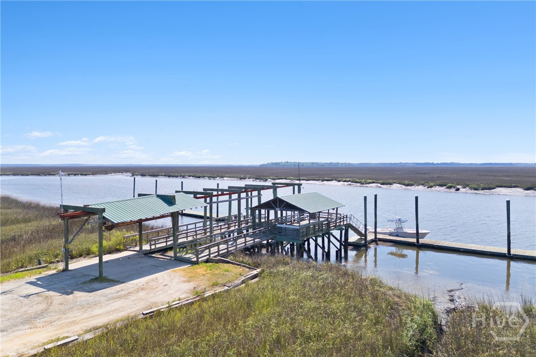 Nearby community dock with covered area and multip