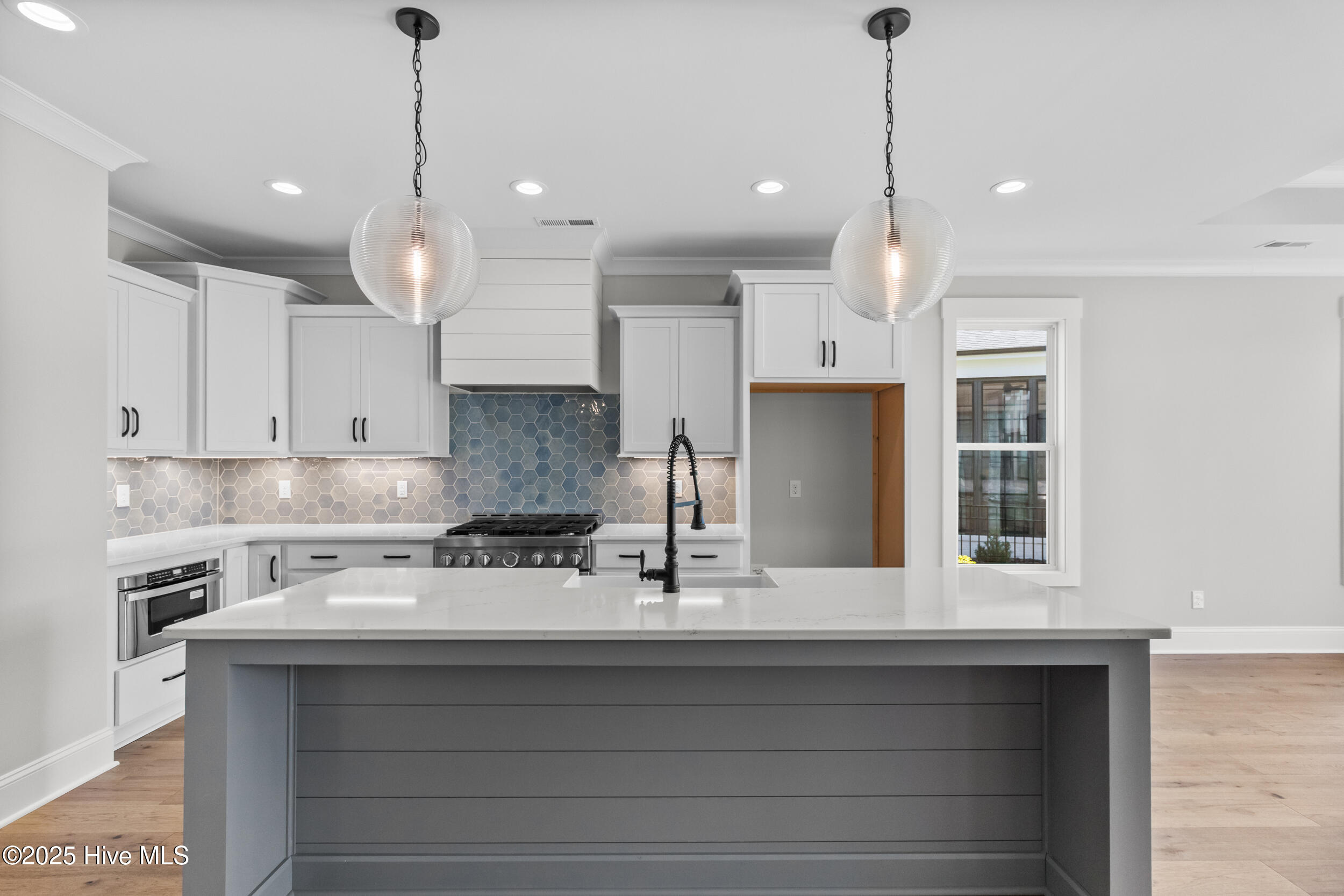 Kitchen with large island, sink, and extra space for seating