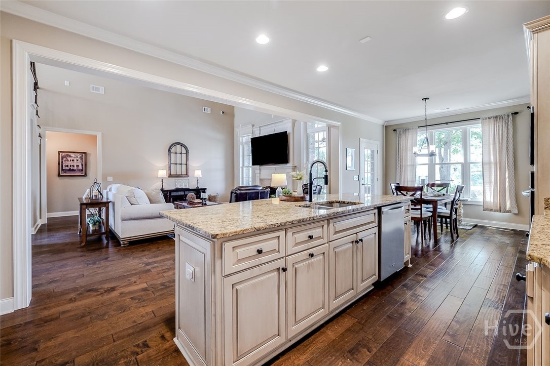 Large island, granite countertops, tons of cabinet and storage space, stainless steel appliances