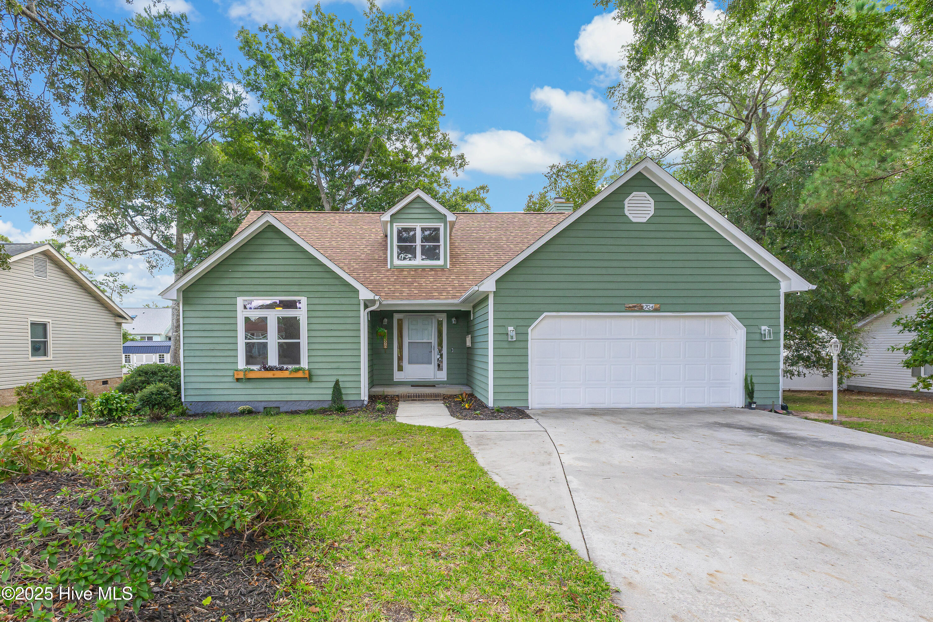 704 Shoreline Drive E, Sunset Beach, NC 28468 – photo 1 of 38: Front