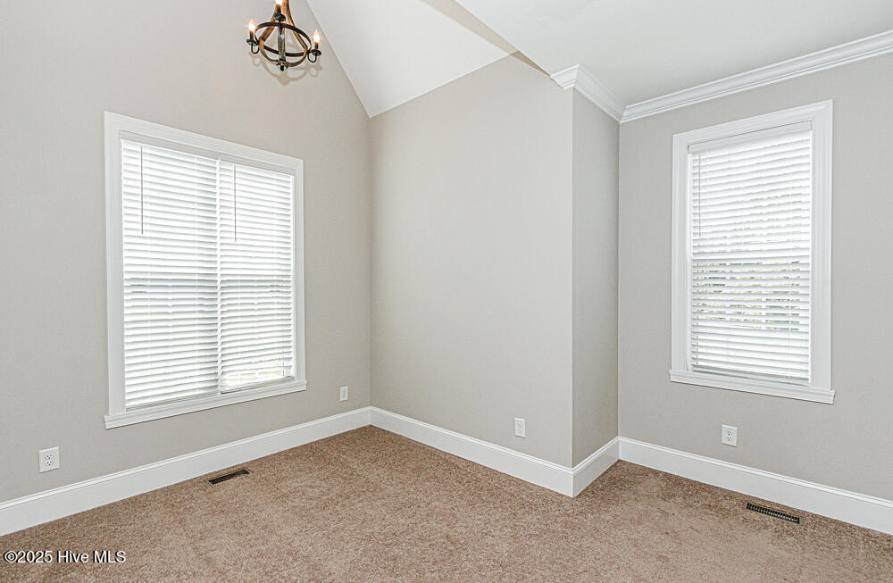 Primary bedroom on 1st floor with additional sitting area.
