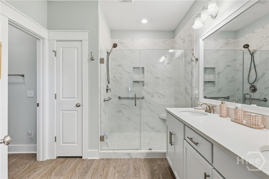 Primary bathroom with extended glass shower