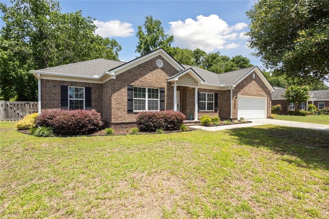 A brick front and offset frontage lends an elegate