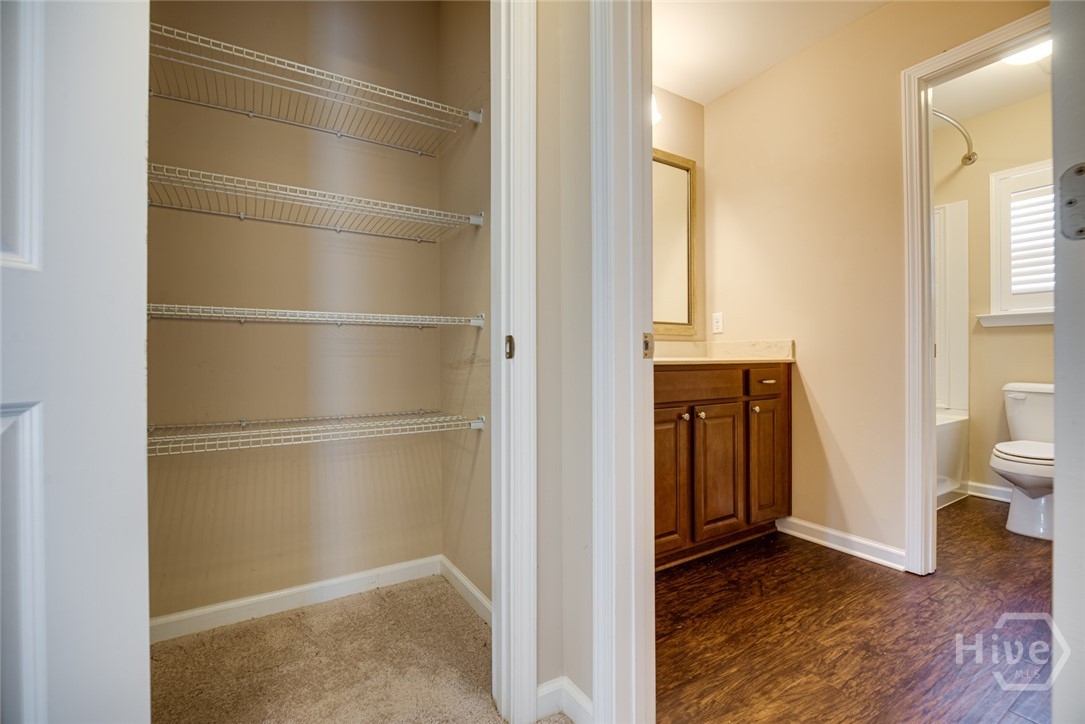 Large linen closet outside secondary bath