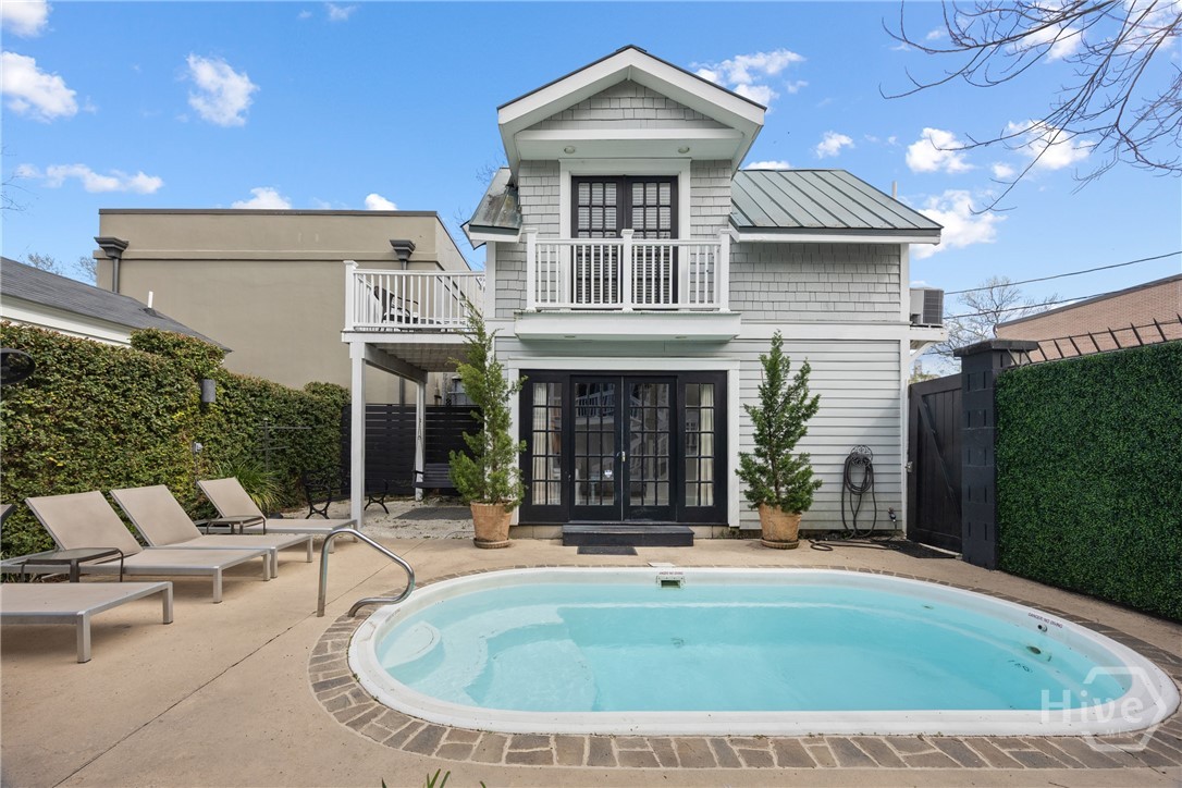 View of Pool/Carriage House Building