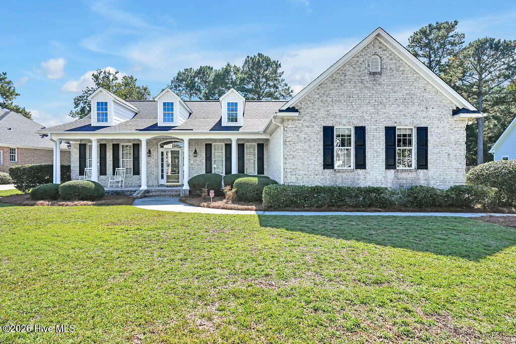 Peaceful location on a .40 acre quiet cul-de-sac in the heart of Magnolia Greens. This thoughtfully designed single-level brick home features two bedrooms, a flex room, two full baths, a screened porch and a side-entry two-car garage. From the rocking chair front porch, enter the foyer and admire the detailed molding, including crown and wainscoting plus hardwood floors. The kitchen has a breakfast bar with updated countertops, tile backsplash, built-in desk, can lighting, ample cabinet & counter space, extra seating at the raised bar, convenient pantry, & a sunny breakfast nook. Enjoy dinner parties with friends and family in the formal dining room. The living room has a vaulted ceiling, ceiling fan and gas log fireplace plus entrance to the screened porch where you can relax & enjoy the fresh air. The primary bedroom has hardwood floor and includes a walk-in closet, dual sink vanity, linen closet, walk-in shower, & a luxurious soaking tub. This one-owner home has been updated with roof replaced 2018 and water heater 2020. Magnolia Greens is a lovely neighborhood with tree-lined streets, sidewalks & street lights throughout. Residents enjoy social activities and incredible amenities with low HOA dues: two outdoor pools, an indoor saltwater pool, two clubhouses, state-of-the-art fitness equipment, an exercise room with classes, library, game room, and locker rooms with showers & saunas. Recreational options include tennis, pickleball, & basketball courts, bocce, playground, picnic & grilling area, + a soccer field. Magnolia Greens also boasts a 27-hole championship golf course with pro shop and Blossoms restaurant. Conveniently located near shopping, dining, golf, and medical offices, just 10 minutes to Downtown Wilmington and 30 minutes to area beaches. You'll love calling Magnolia Greens Home!